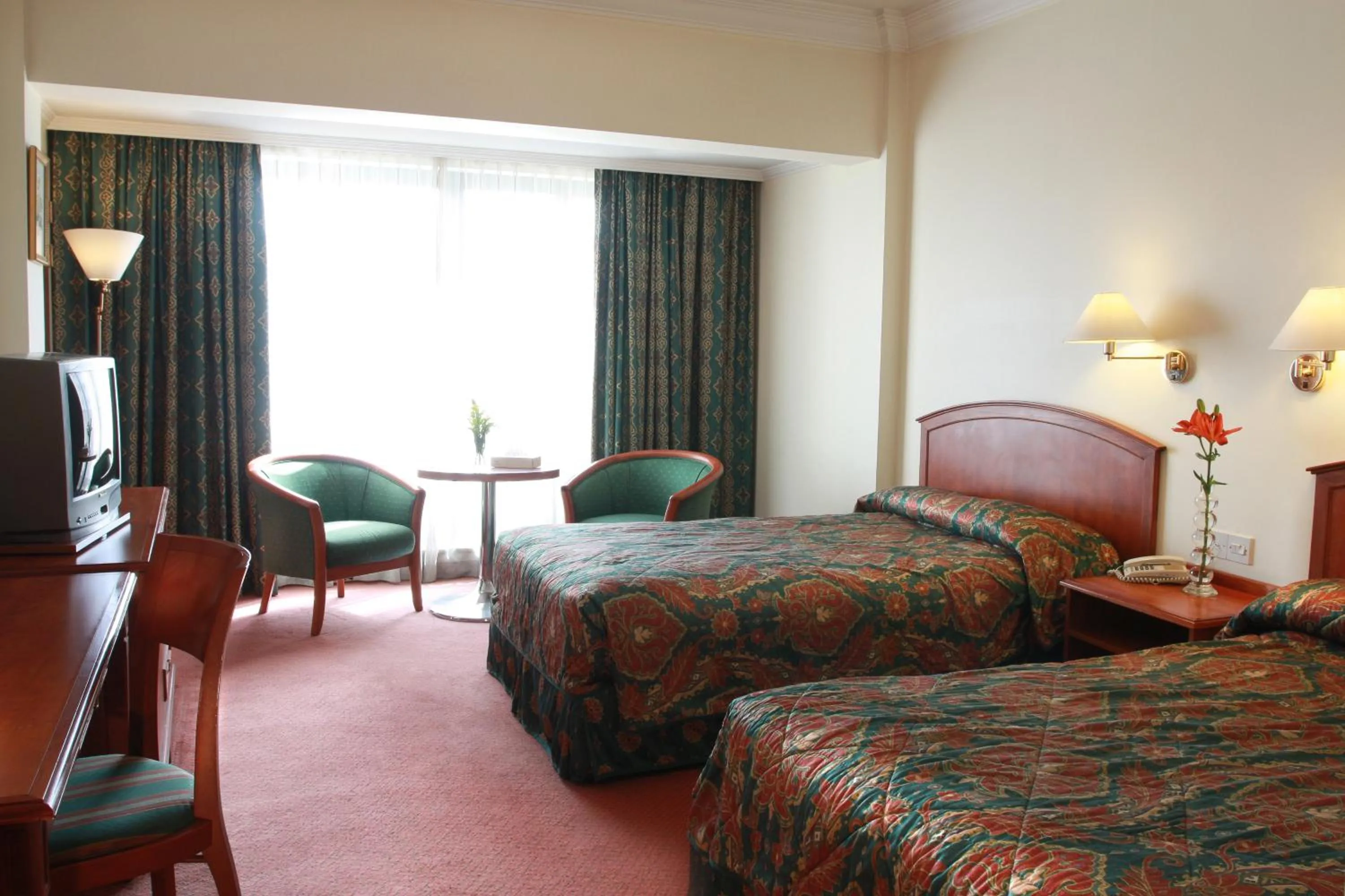 Bed in Grand Palace Hotel