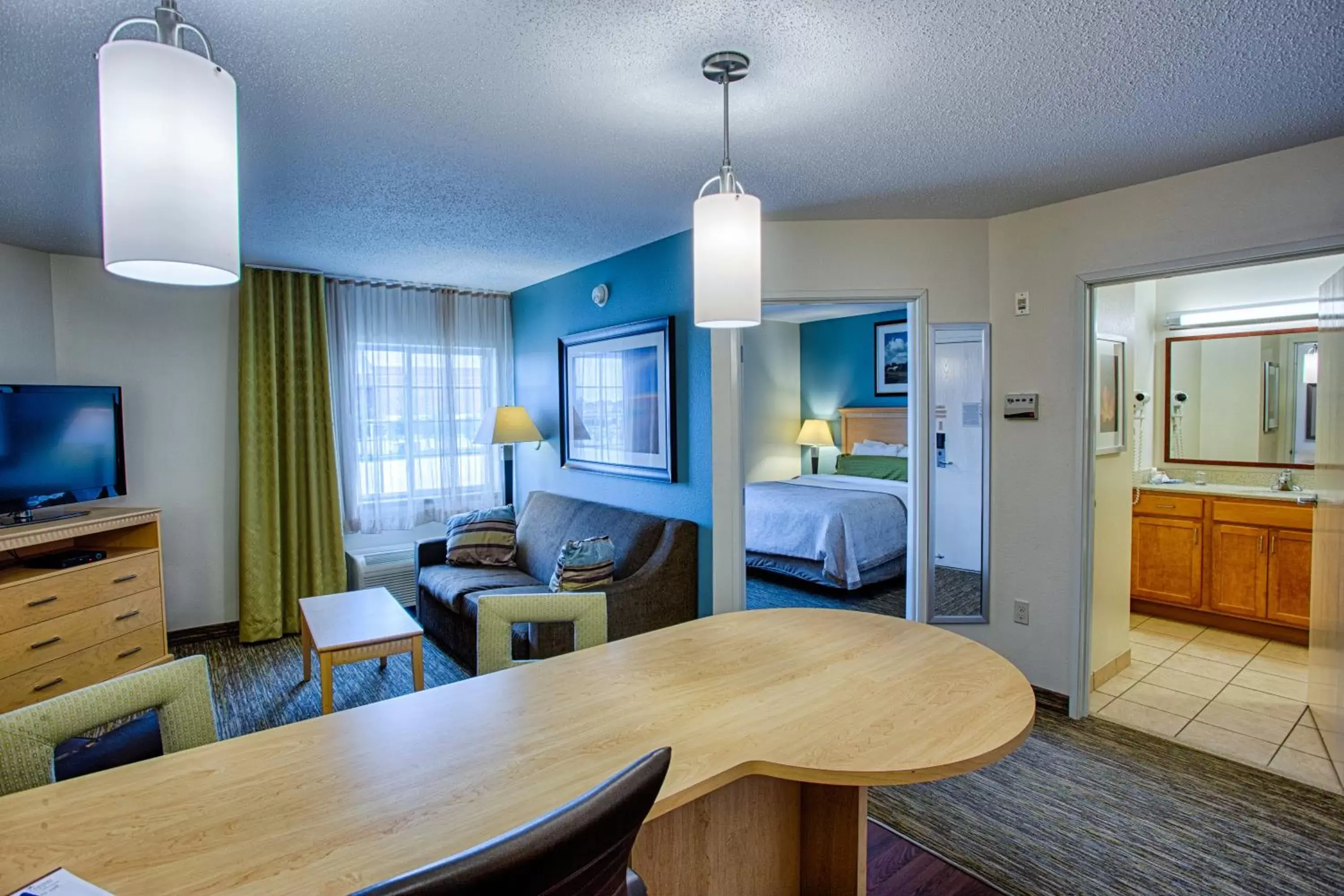 Bedroom in Candlewood Suites Fargo-North Dakota State University, an IHG Hotel