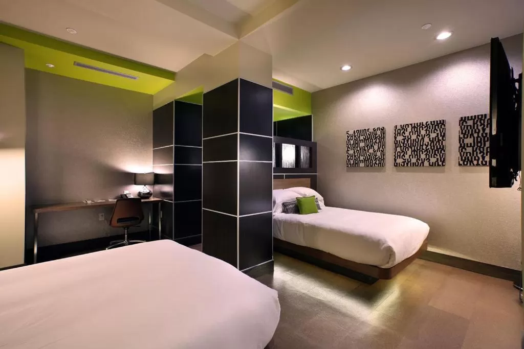 Bed in CityFlatsHotel - Grand Rapids, an Ascend Collection Hotel