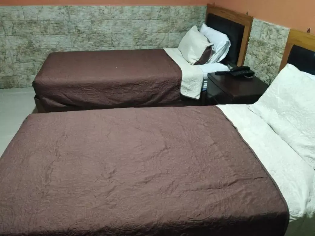 Bed in Amman Palace Hotel