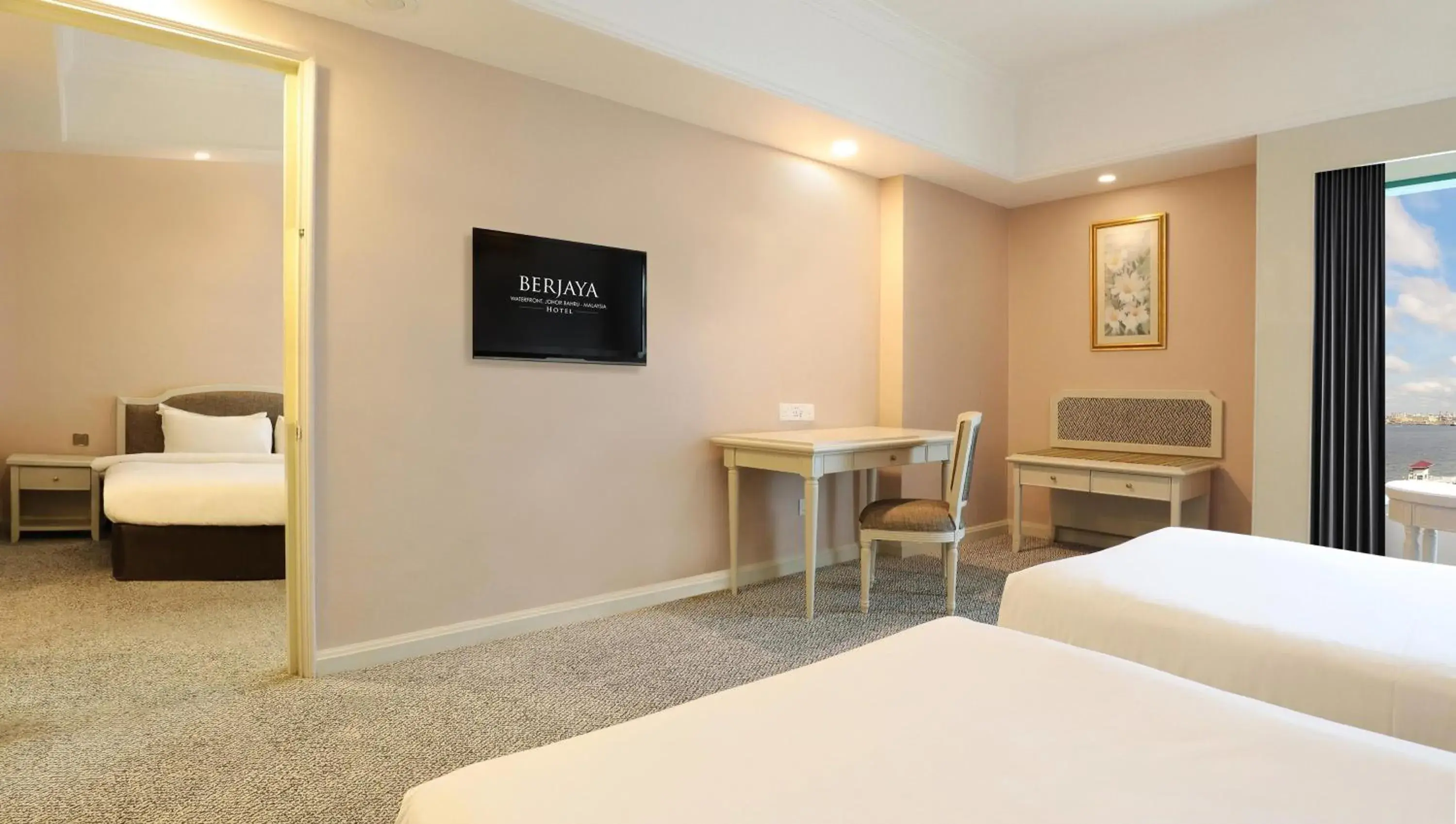 Bed, TV/Entertainment Center in Berjaya Waterfront Hotel