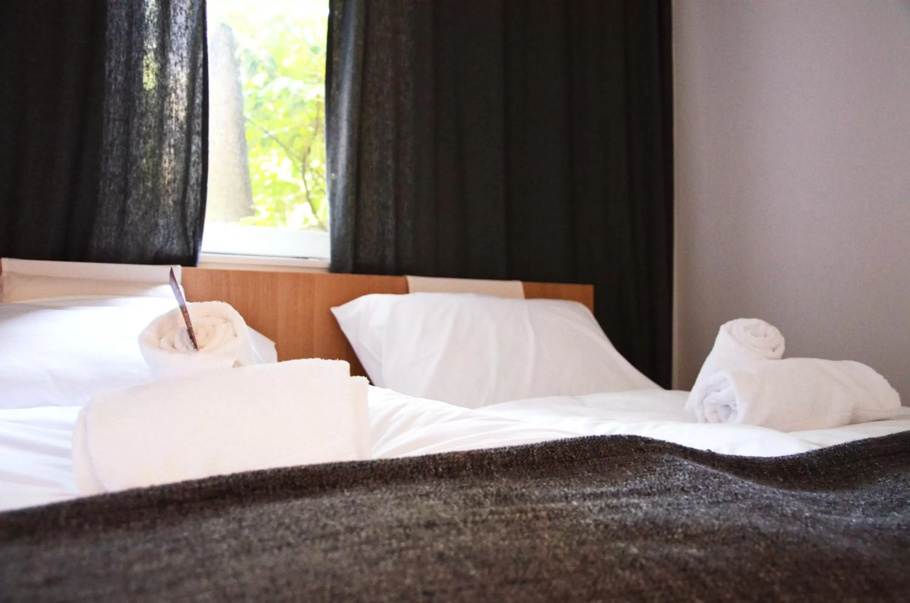 Bed in Forgotten Garden Apartments Portoroz