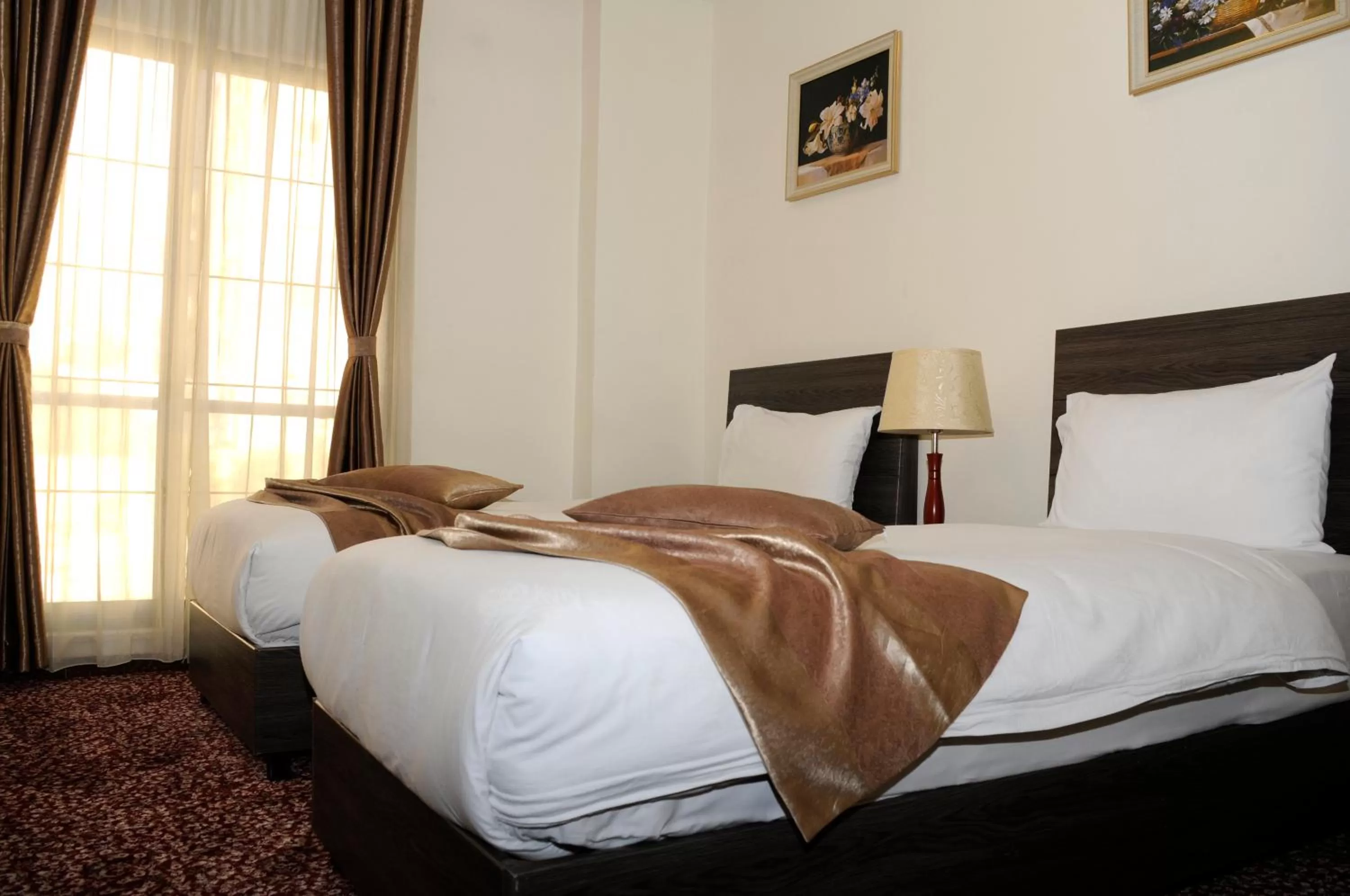 Bed in Olive Hotel Amman