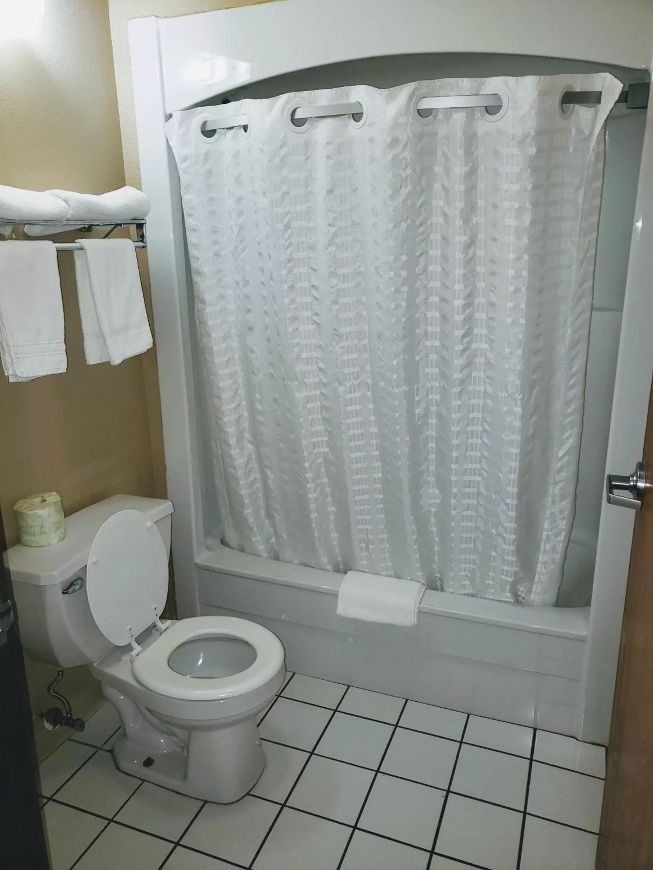 Bathroom in Days Inn & Suites by Wyndham of Morris