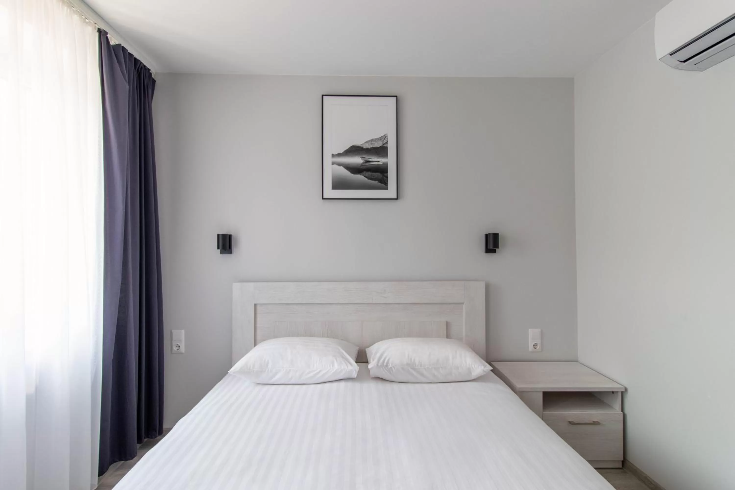 Bed in Dzukija Hotel