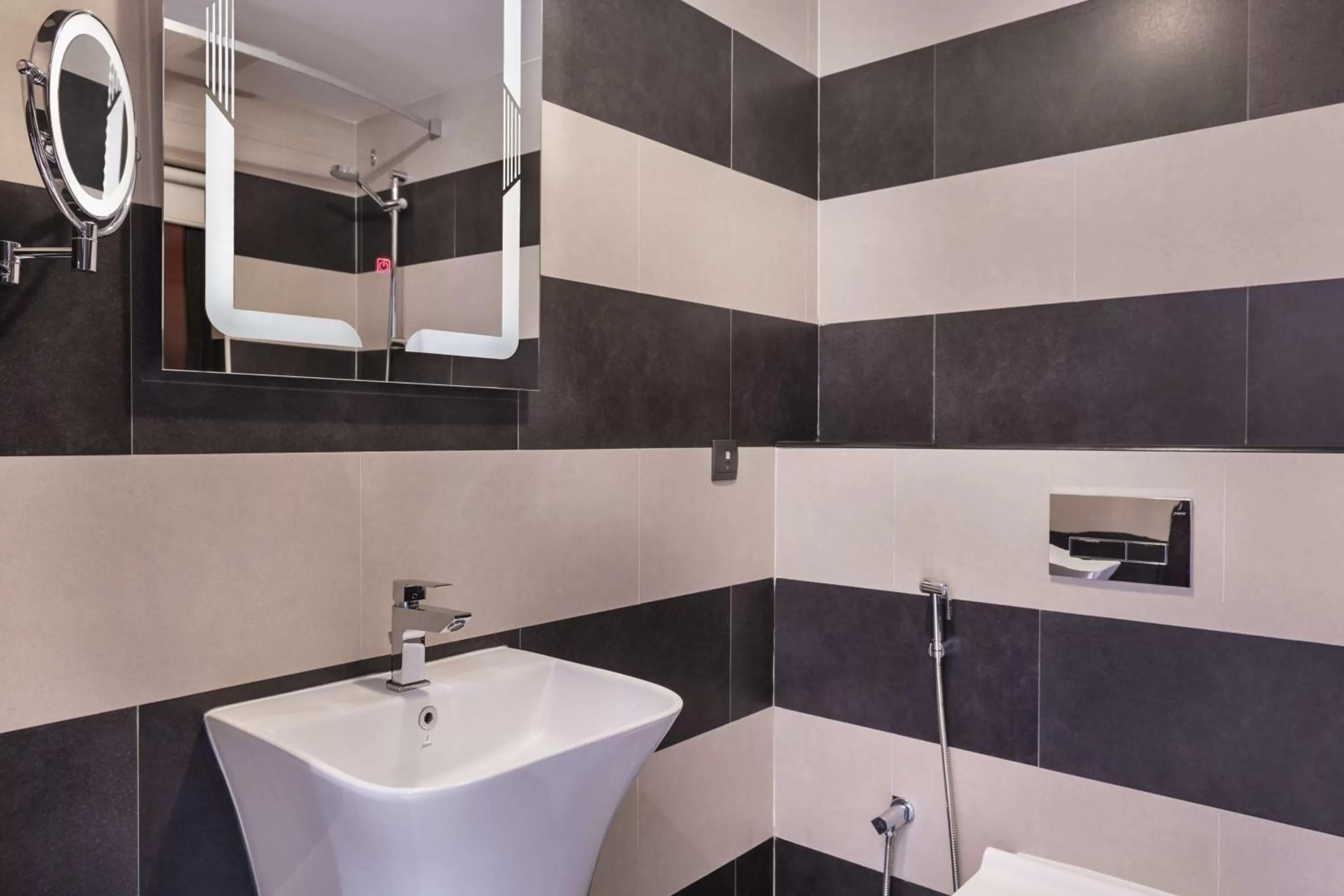 Toilet in Radisson Blu Hotel & Resort, Al Ain