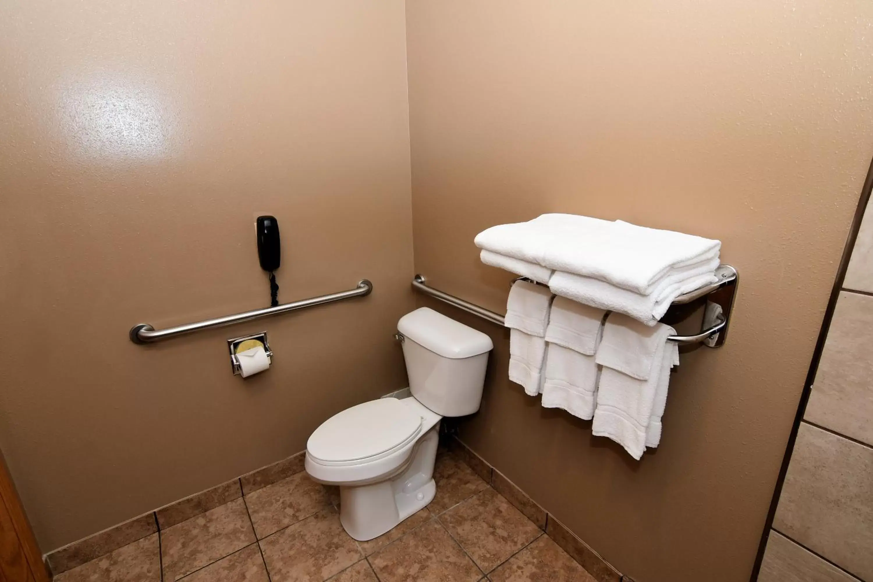 Toilet, Bathroom in Cobblestone Inn & Suites - Denison | Majestic Hills