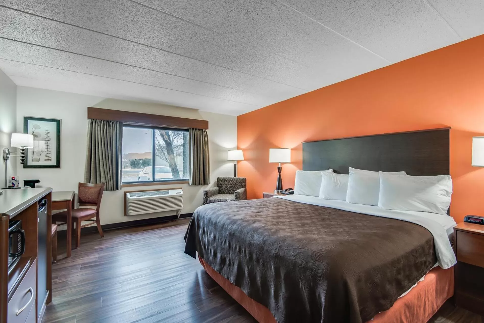 Bed in AmericInn by Wyndham Coon Rapids