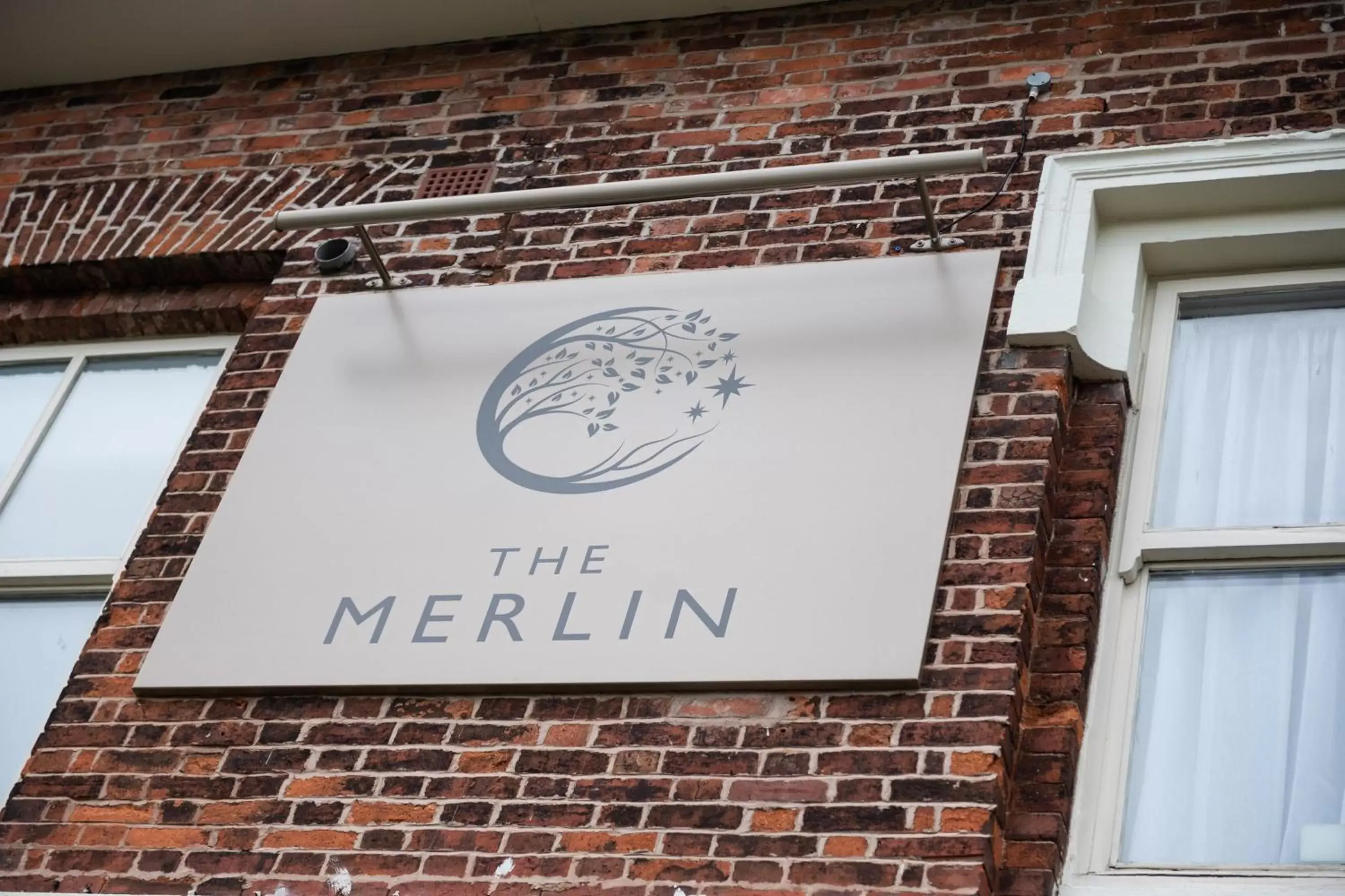 Property logo or sign in The Merlin by Innkeeper's Collection