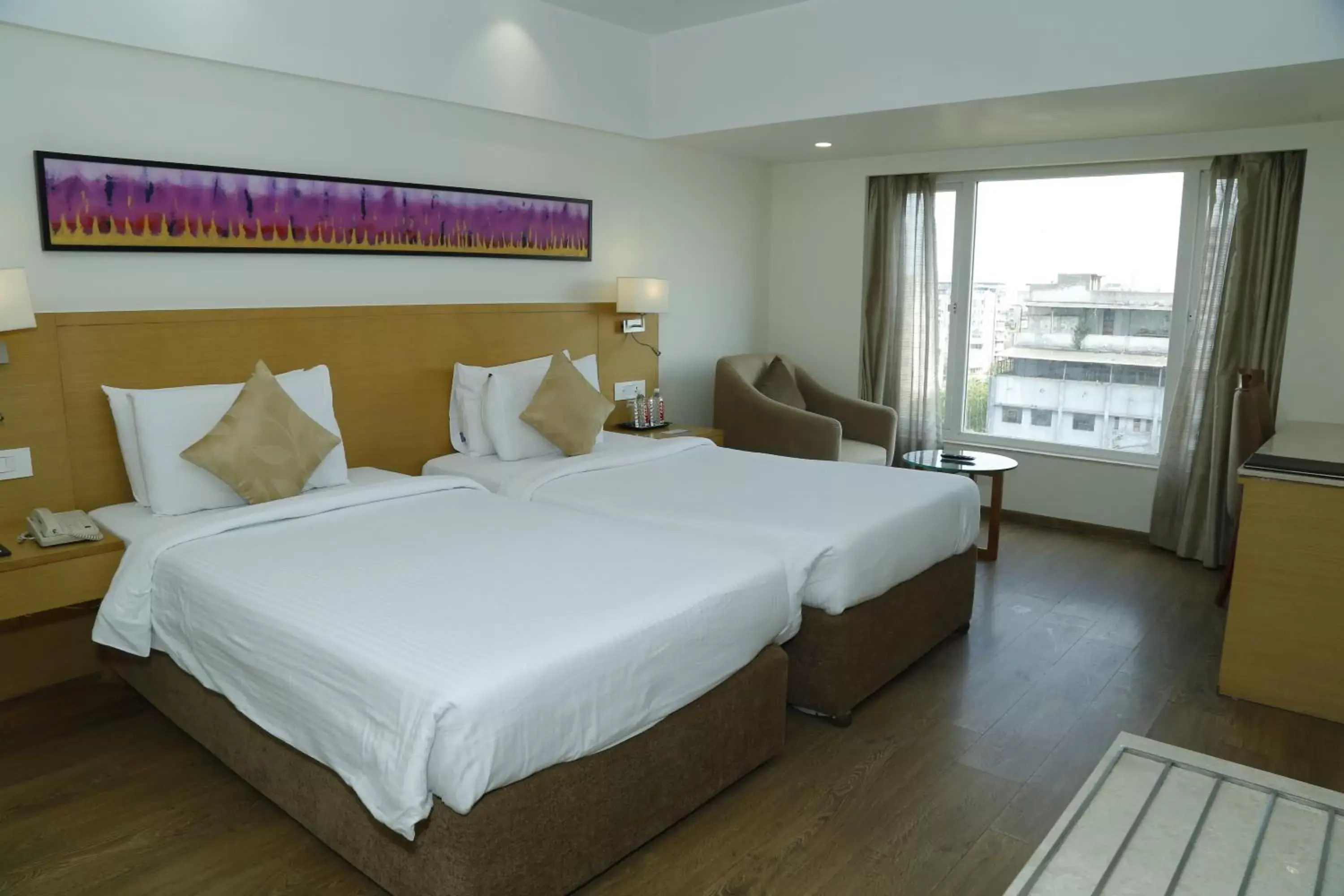 Bed in Sarovar Portico Rivera Ahmedabad