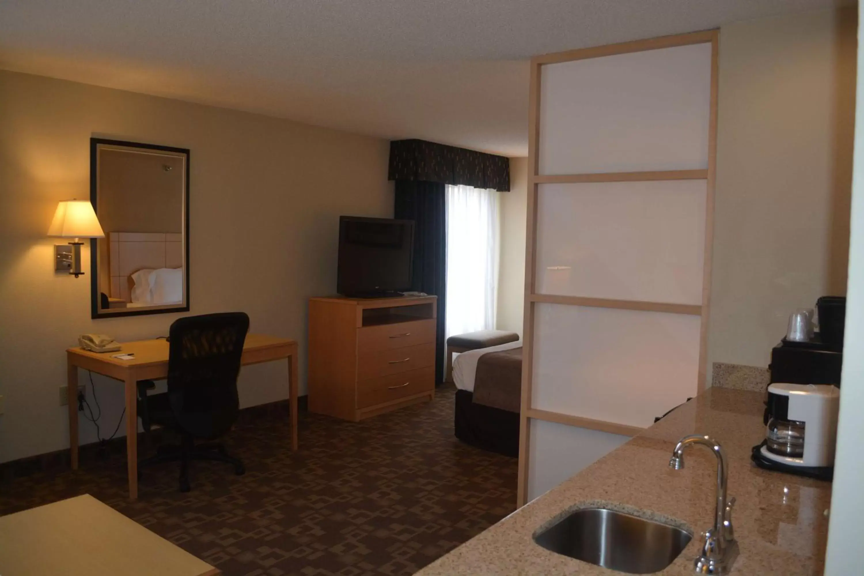 Photo of the whole room, TV/Entertainment Center in SureStay Plus Hotel by Best Western Roanoke Rapids I-95