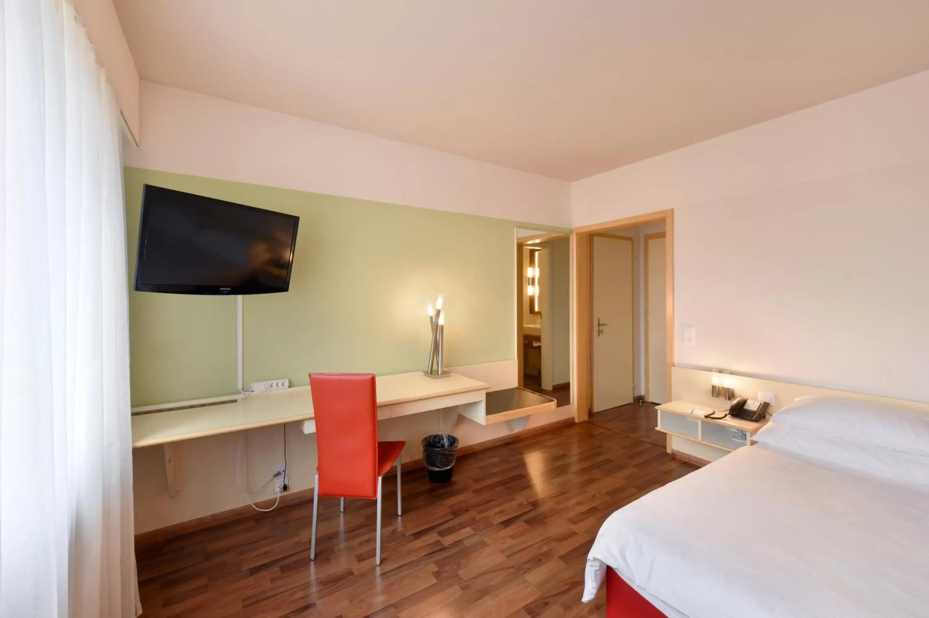 Photo of the whole room, TV/Entertainment Center in City Hotel Biel Bienne Free Parking