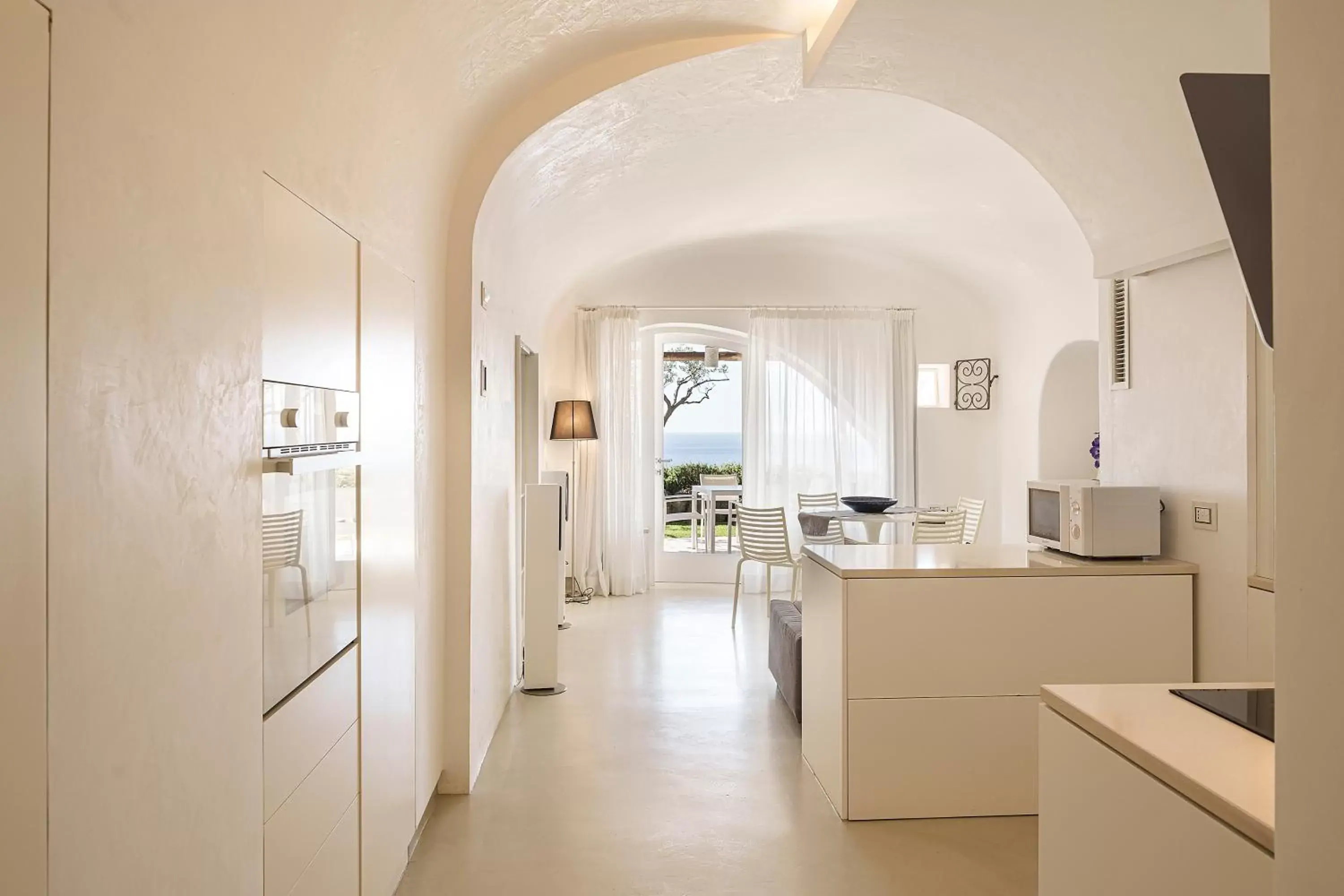 Living room, Kitchen/Kitchenette in Costa Del Capitano Seaview Suites & Villas