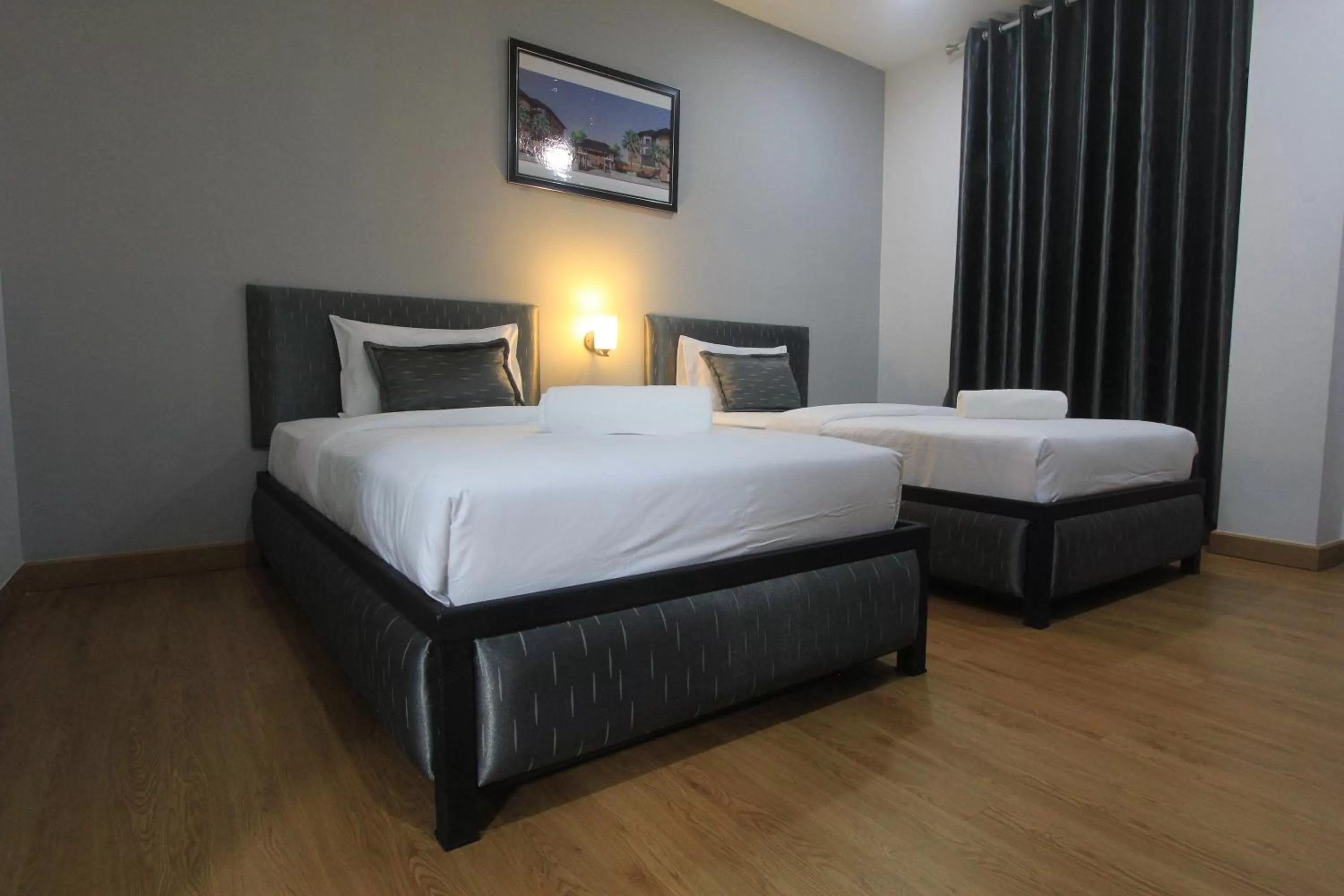 Bed in The Mira Hotel Chiang Rai