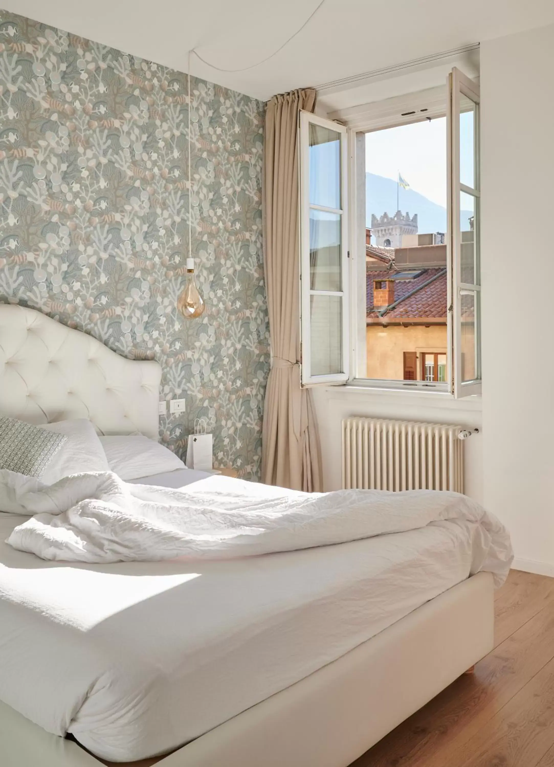 Bed in Lainez Rooms & Suites