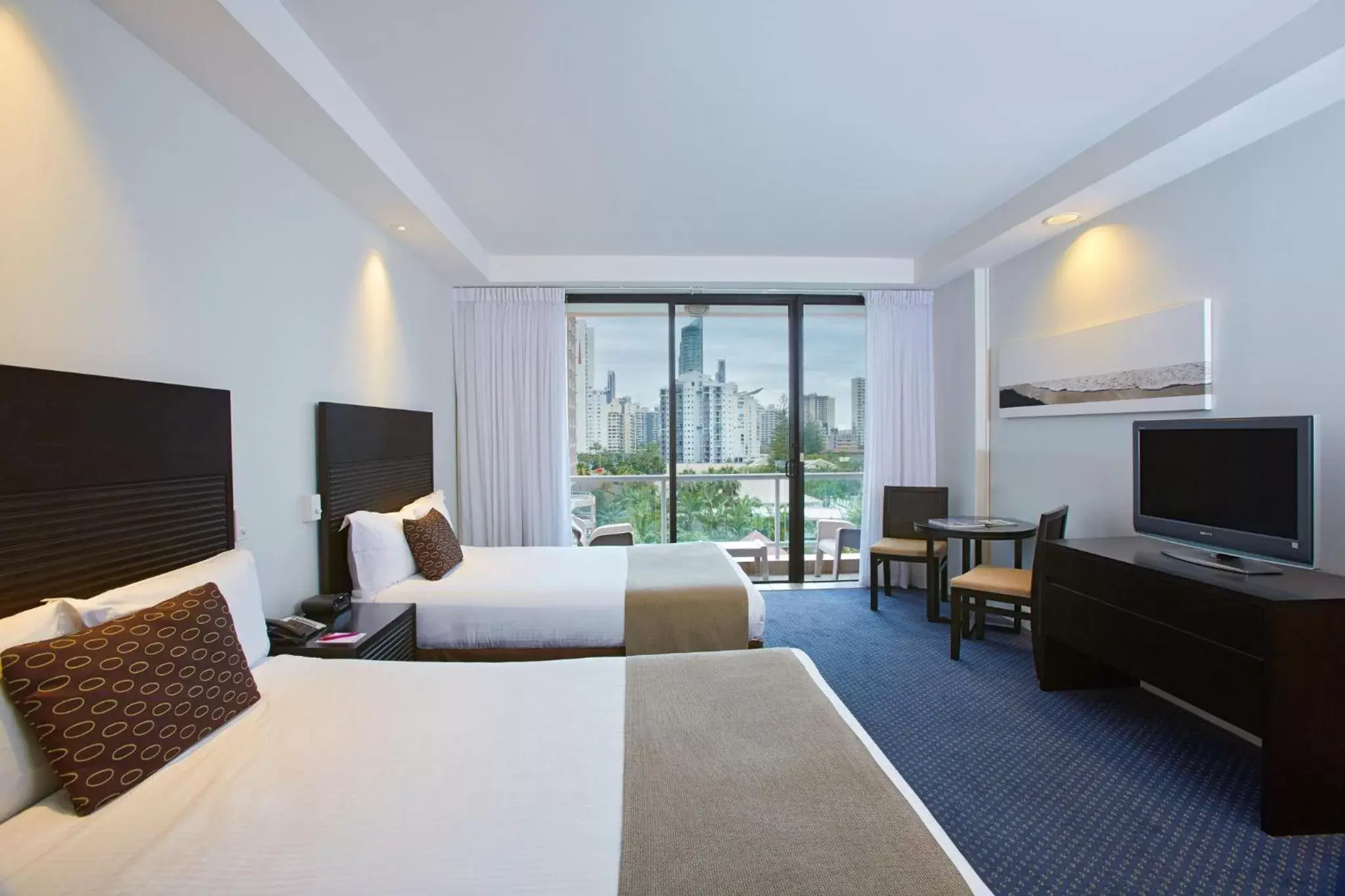 Photo of the whole room, TV/Entertainment Center in Crowne Plaza Surfers Paradise, an IHG Hotel