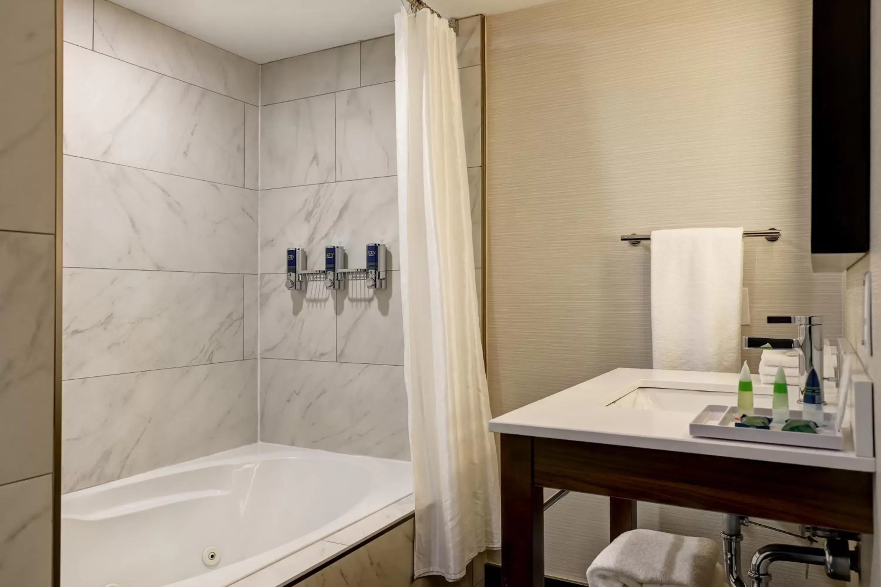 Bathroom in Four Points by Sheraton St. Catharines Niagara Suites