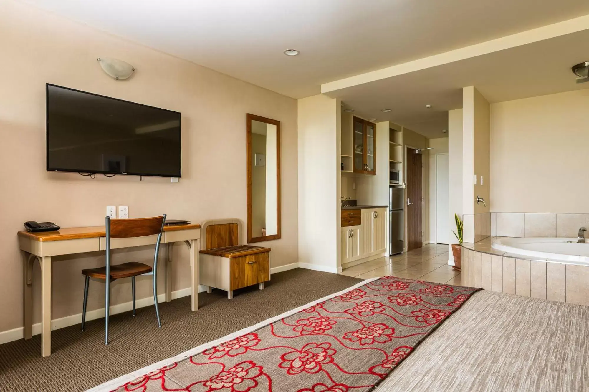 Photo of the whole room, TV/Entertainment Center in Pebble Beach Motor Inn