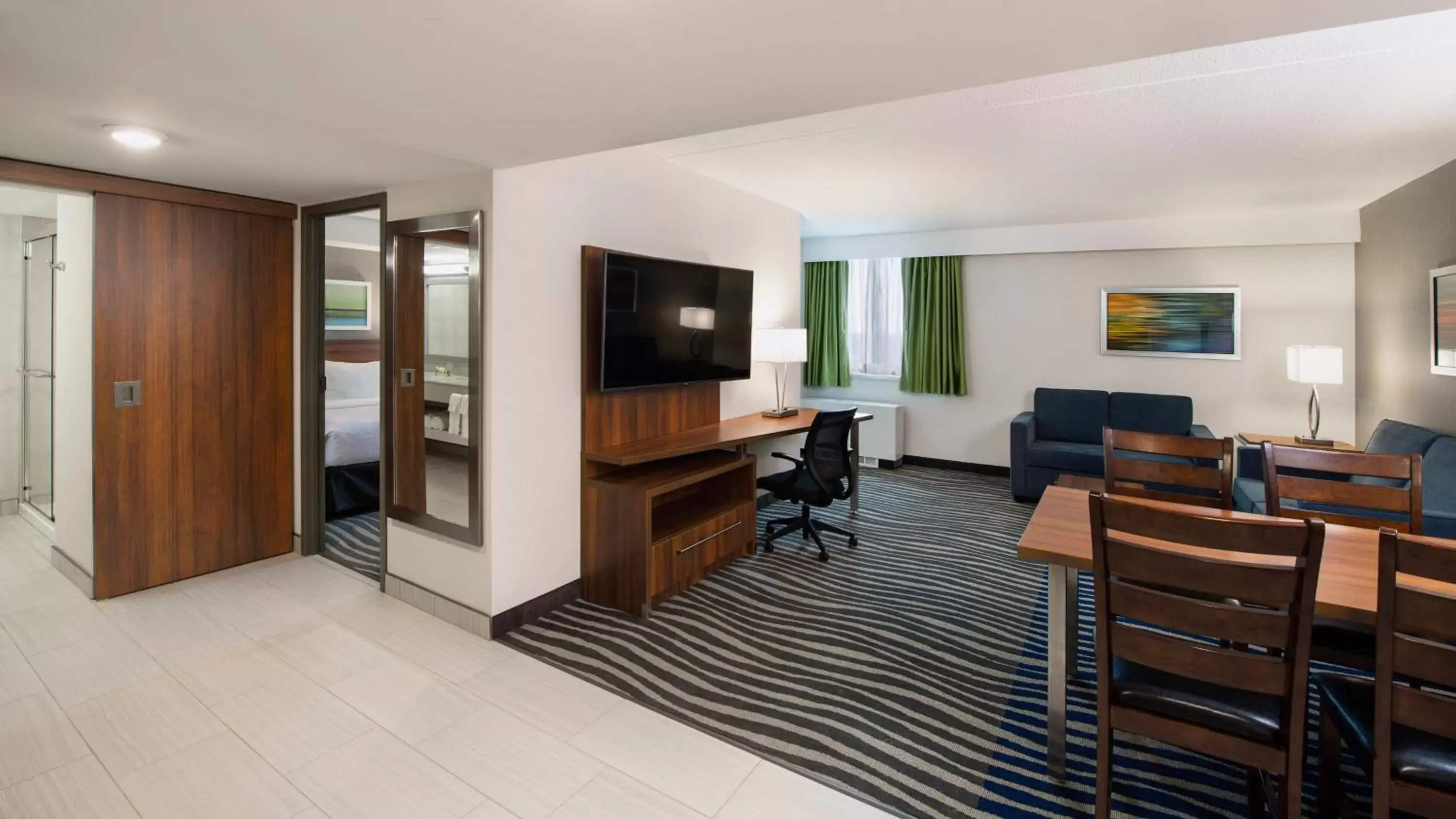 Photo of the whole room, TV/Entertainment Center in Holiday Inn Winnipeg - Airport West, an IHG Hotel