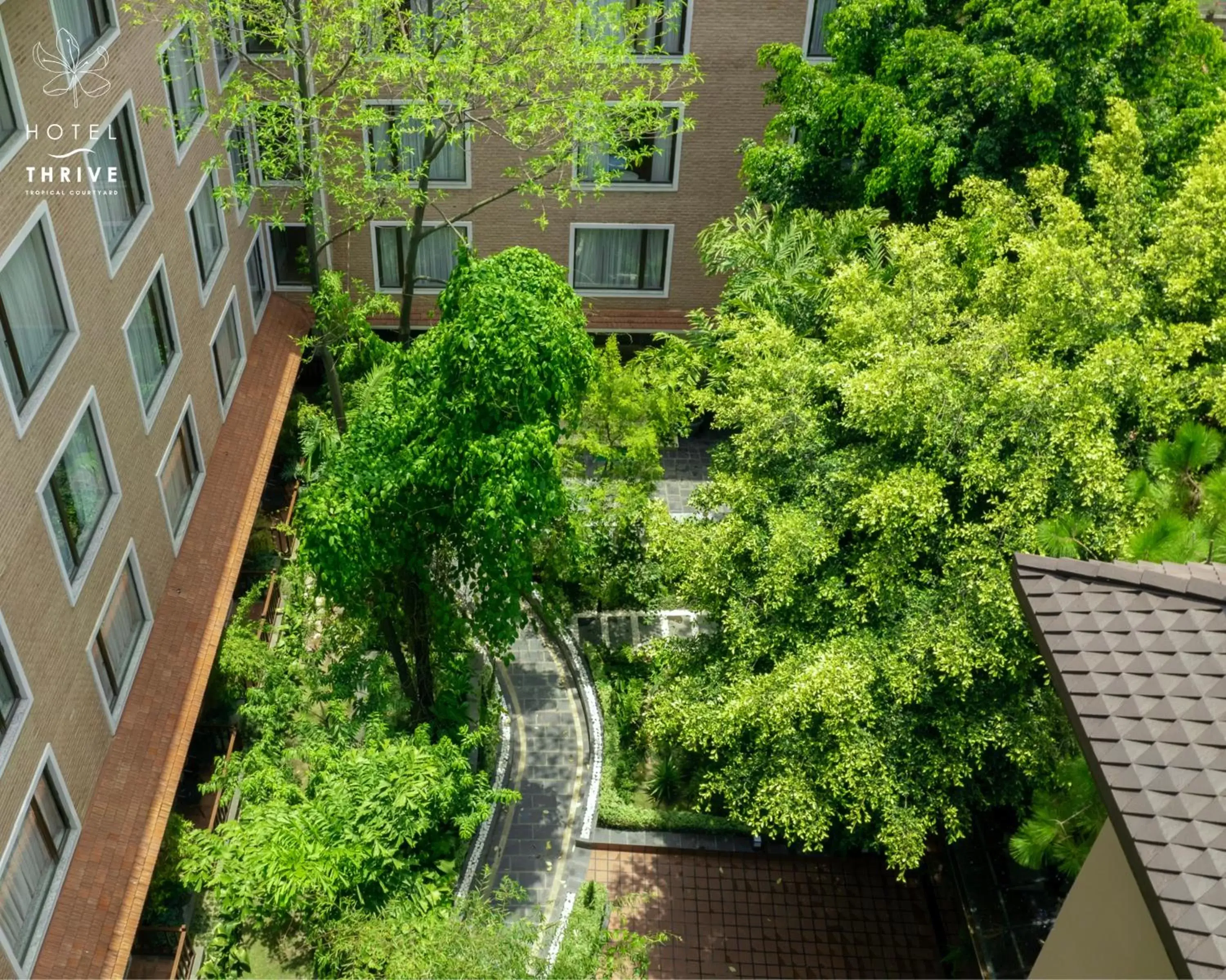 Property building in Hotel Thrive, A Tropical Courtyard Property building in Hotel Thrive, A Tropical Courtyard