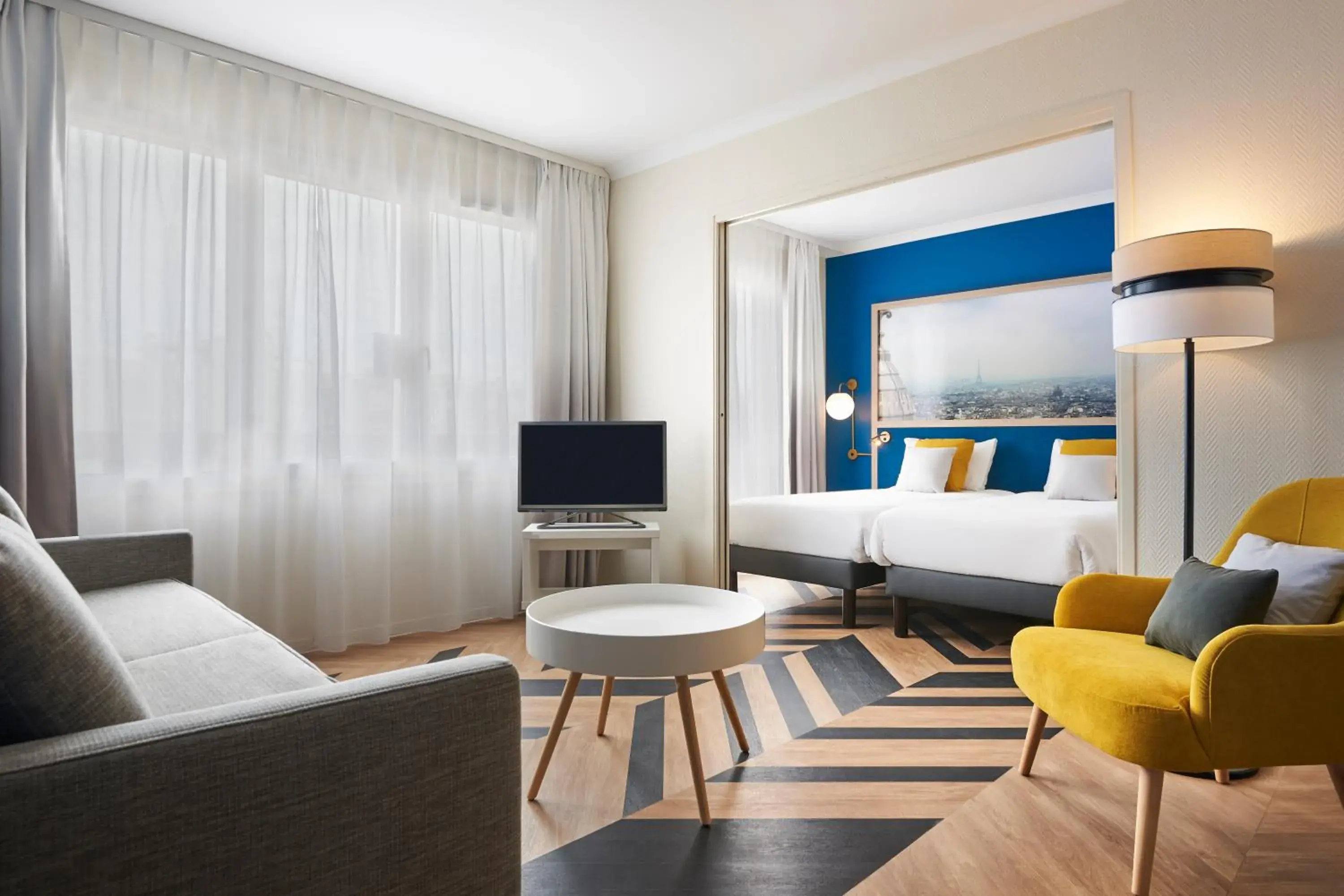 Living room, Bed in Aparthotel Adagio Porte de Versailles Living room, Bed in Aparthotel Adagio Porte de Versailles