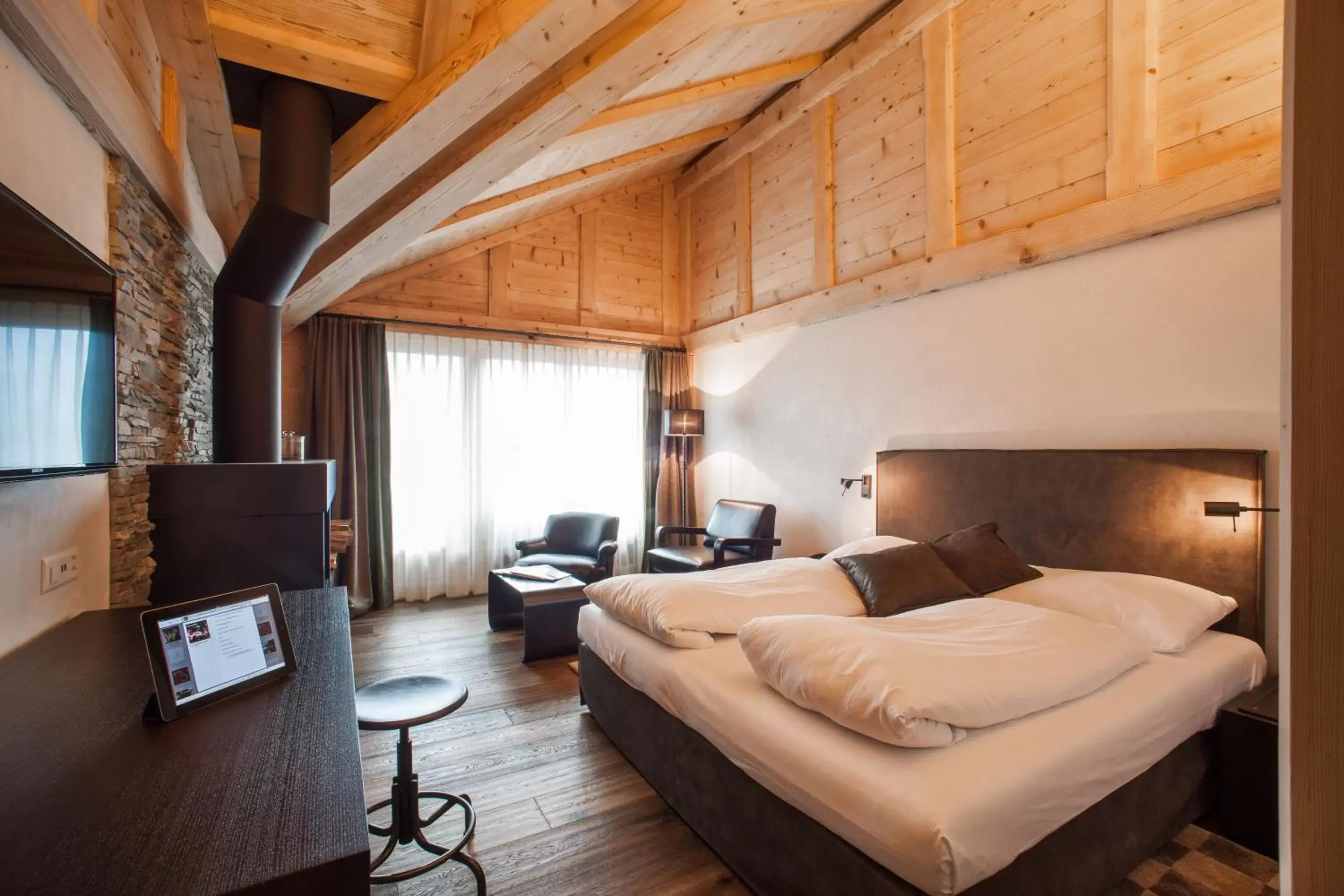 Photo of the whole room, Bed in Bernerhof Swiss Quality Hotel Gstaad