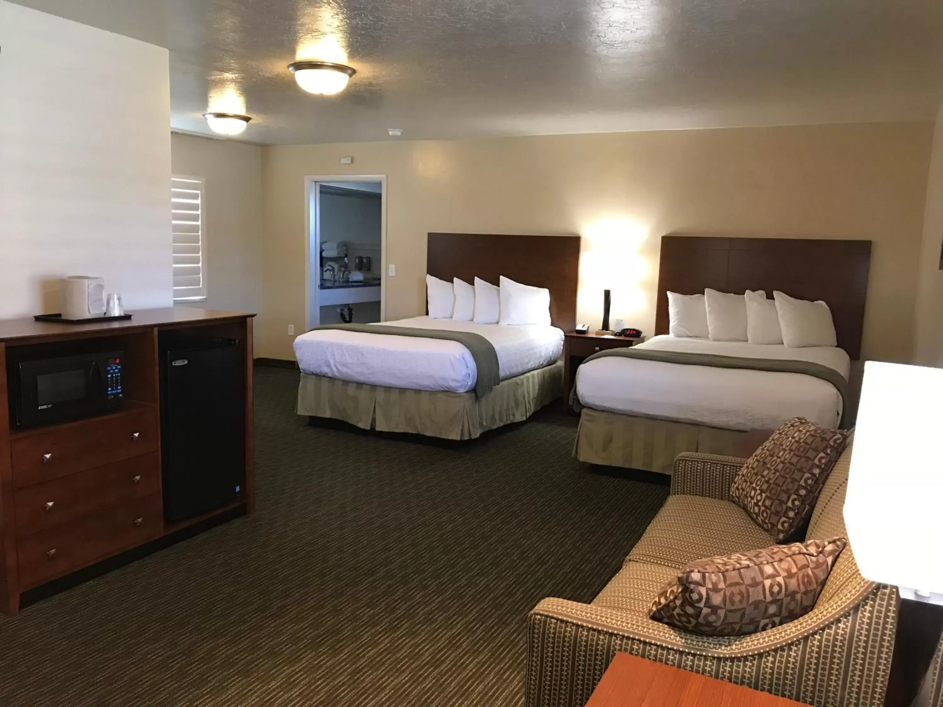 Two Queen Suite with Roll-In Shower - Non-Smoking/Disability Access in Dinosaur Inn & Suites Two Queen Suite with Roll-In Shower - Non-Smoking/Disability Access in Dinosaur Inn & Suites