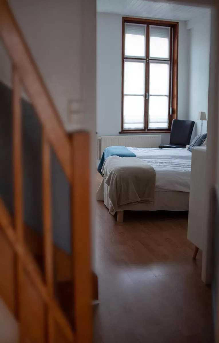 Photo of the whole room, Bed in Bienvenue Chez Nous