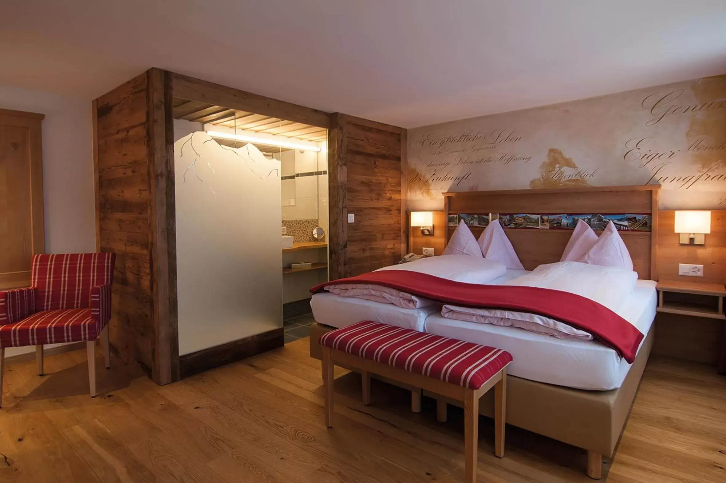 Photo of the whole room, Bed in Alpenblick Hotel & Restaurant Wilderswil by Interlaken