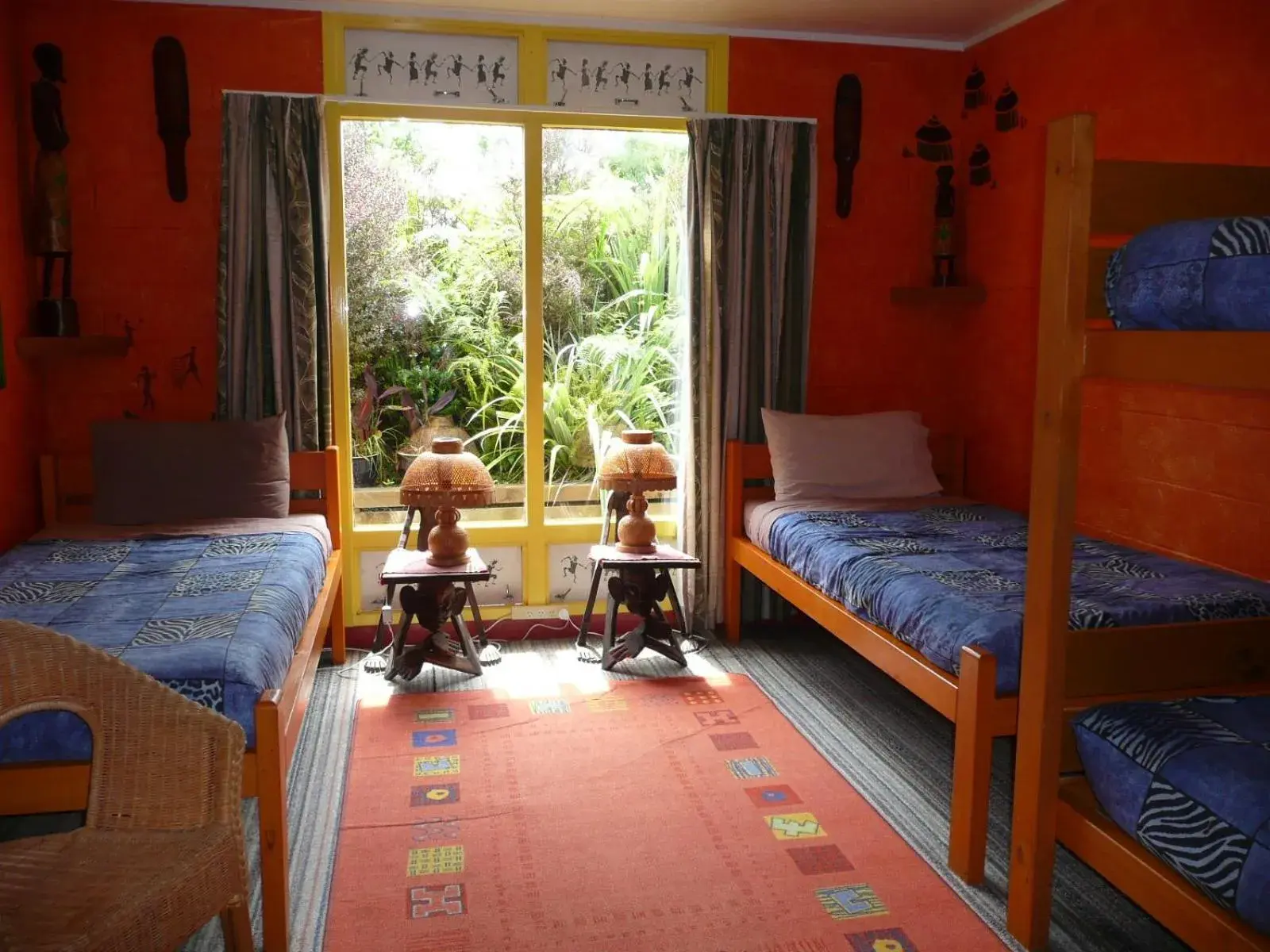 Bed, Seating Area in Global Village Travellers Lodge