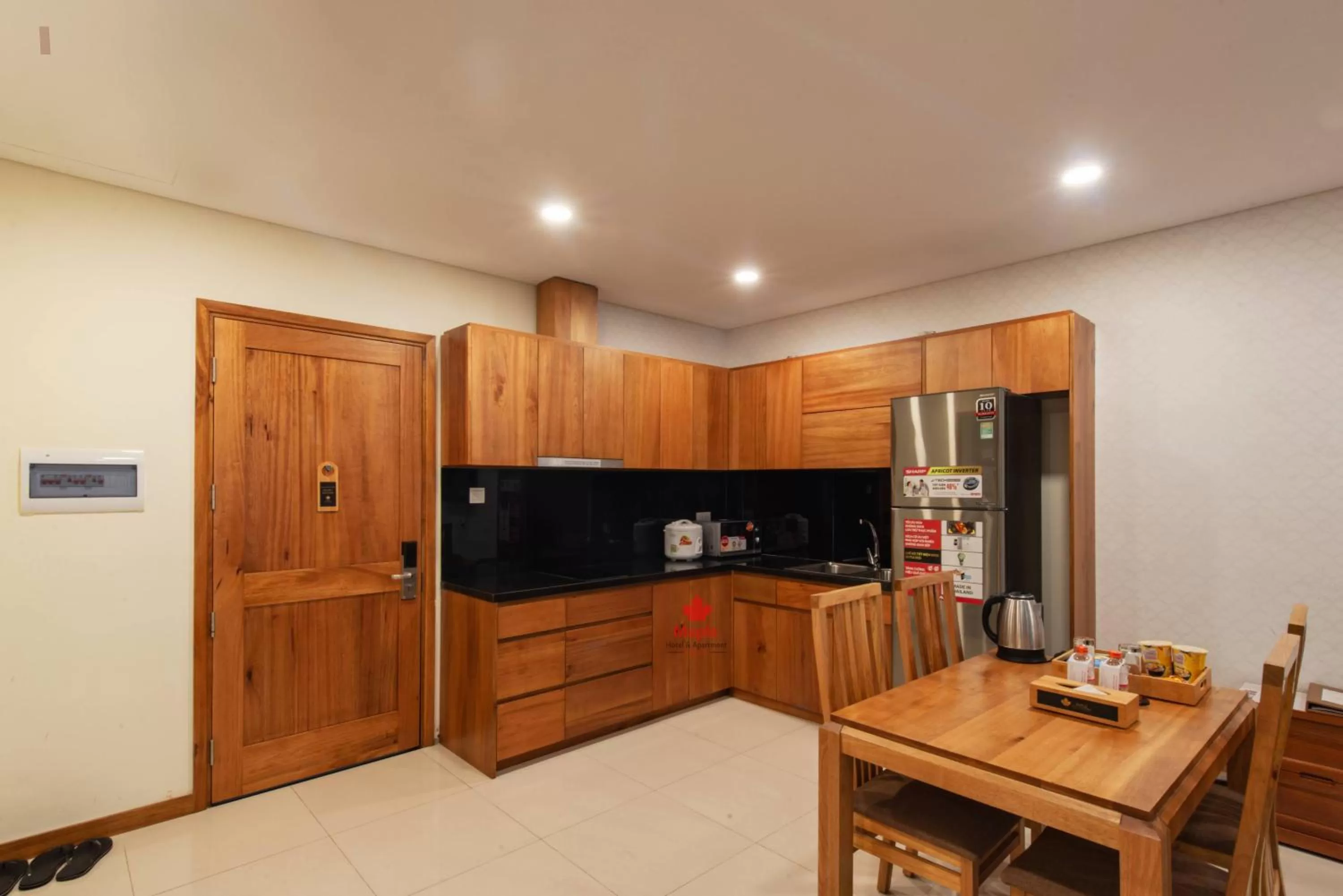 Kitchen or kitchenette in Maple Hotel & Apartment