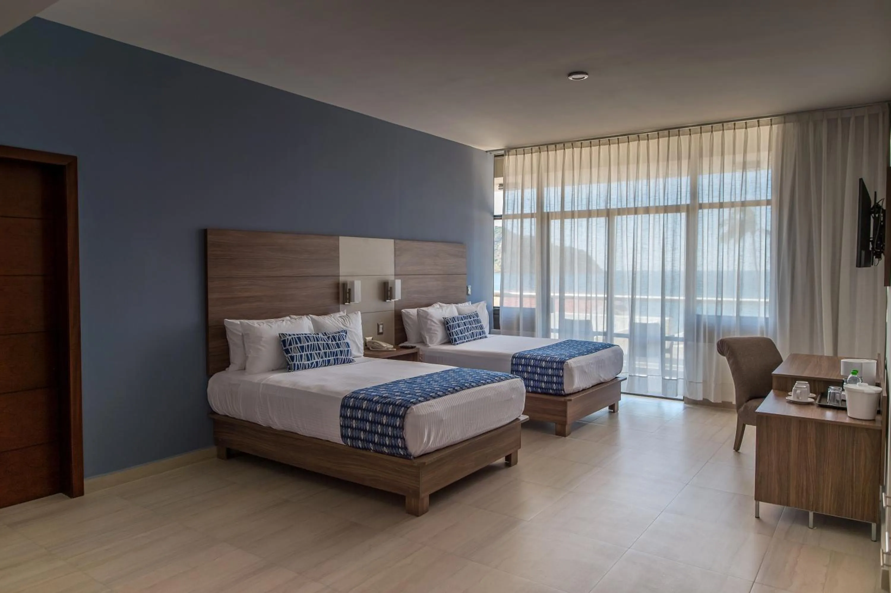 Photo of the whole room, Bed in Ocean View Beach Hotel