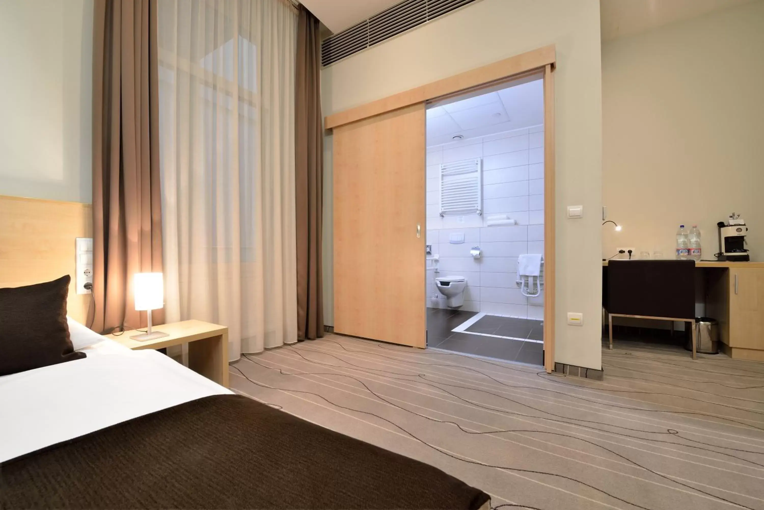 Bathroom, Bed in Promenade City Hotel