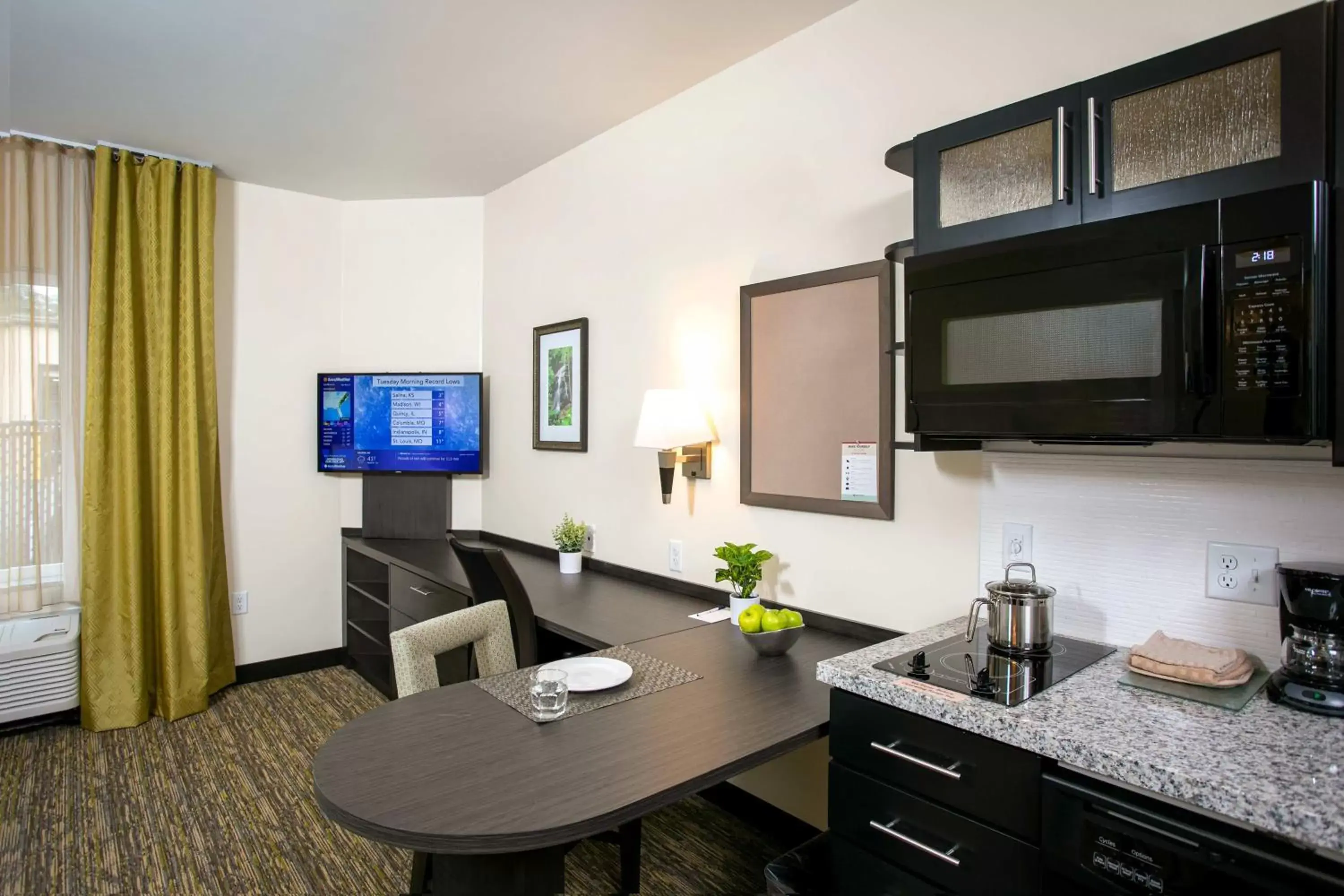 Photo of the whole room, TV/Entertainment Center in Candlewood Suites - Jacksonville - Mayport, an IHG Hotel