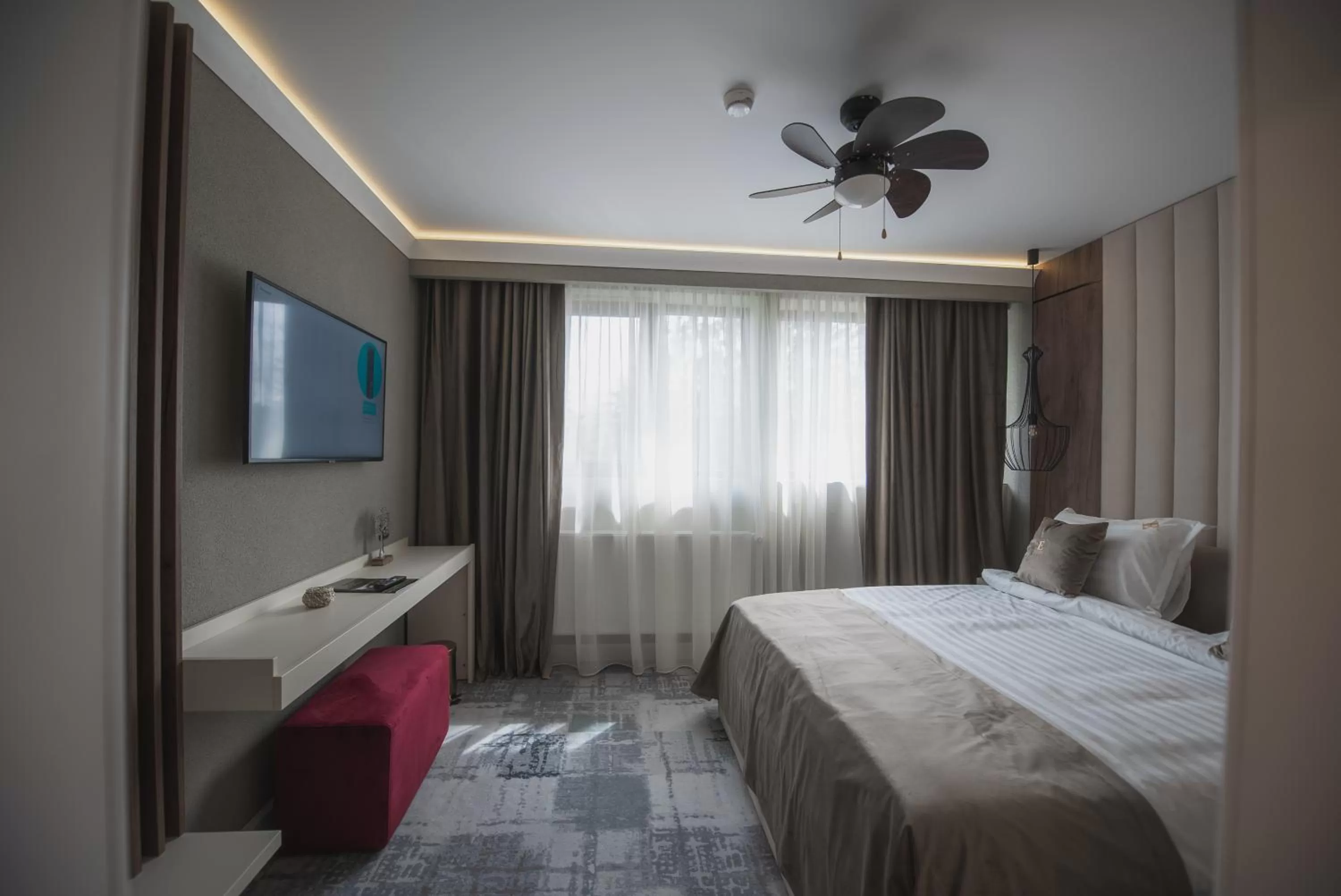 Photo of the whole room, Bed in Elexus Boutique