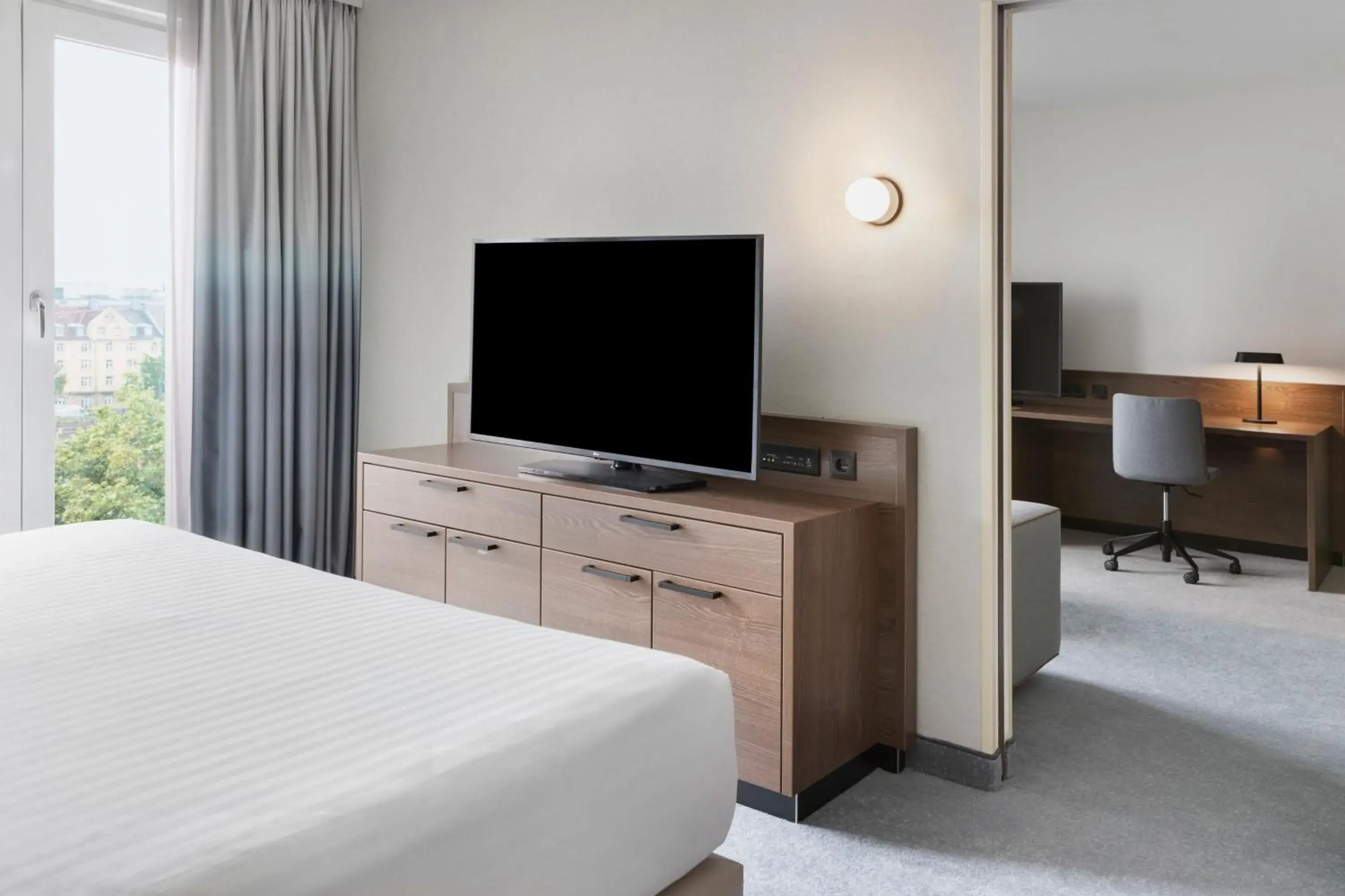 Bedroom, TV/Entertainment Center in Courtyard by Marriott Munich City East