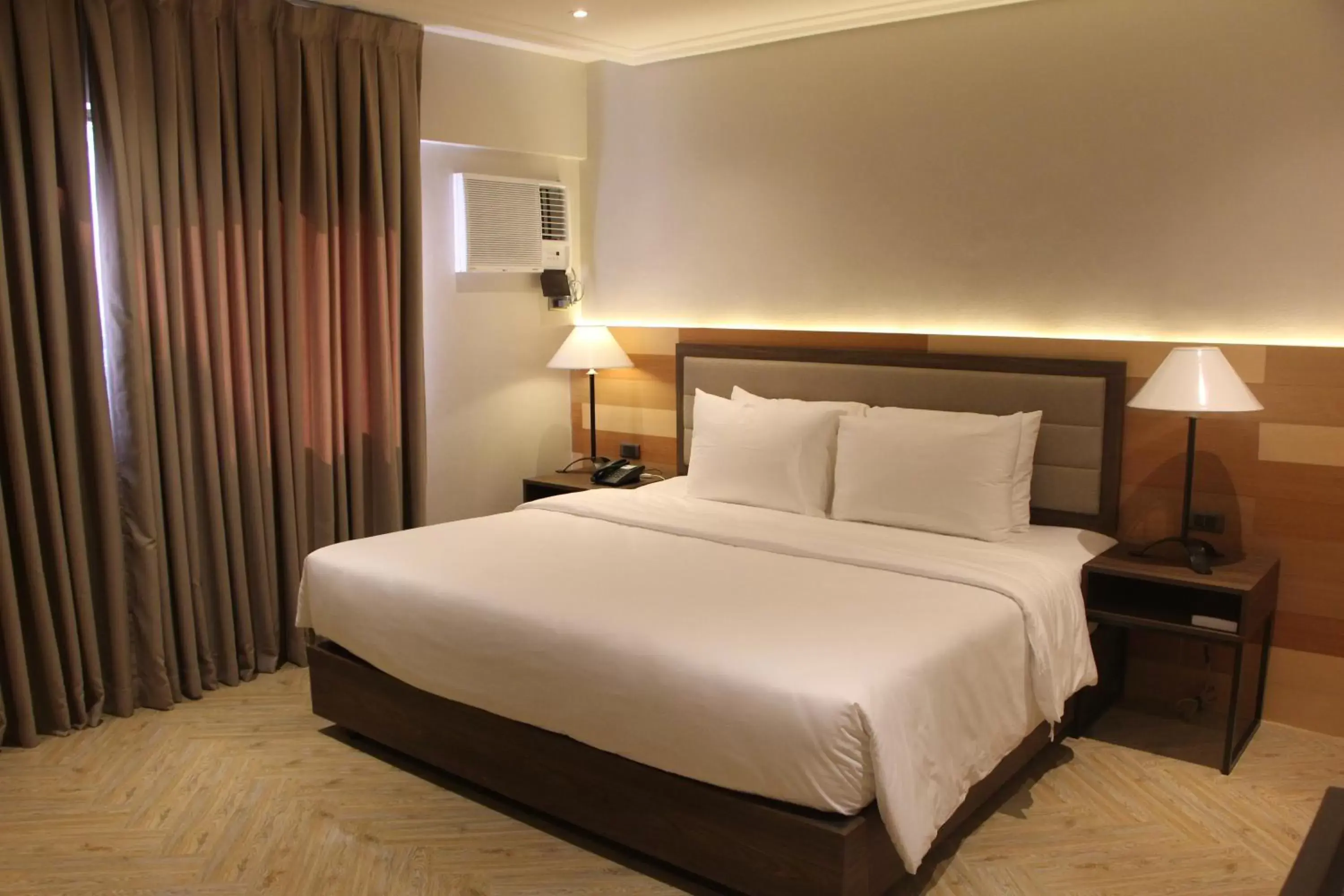 Bed in Acacia Hotel Bacolod