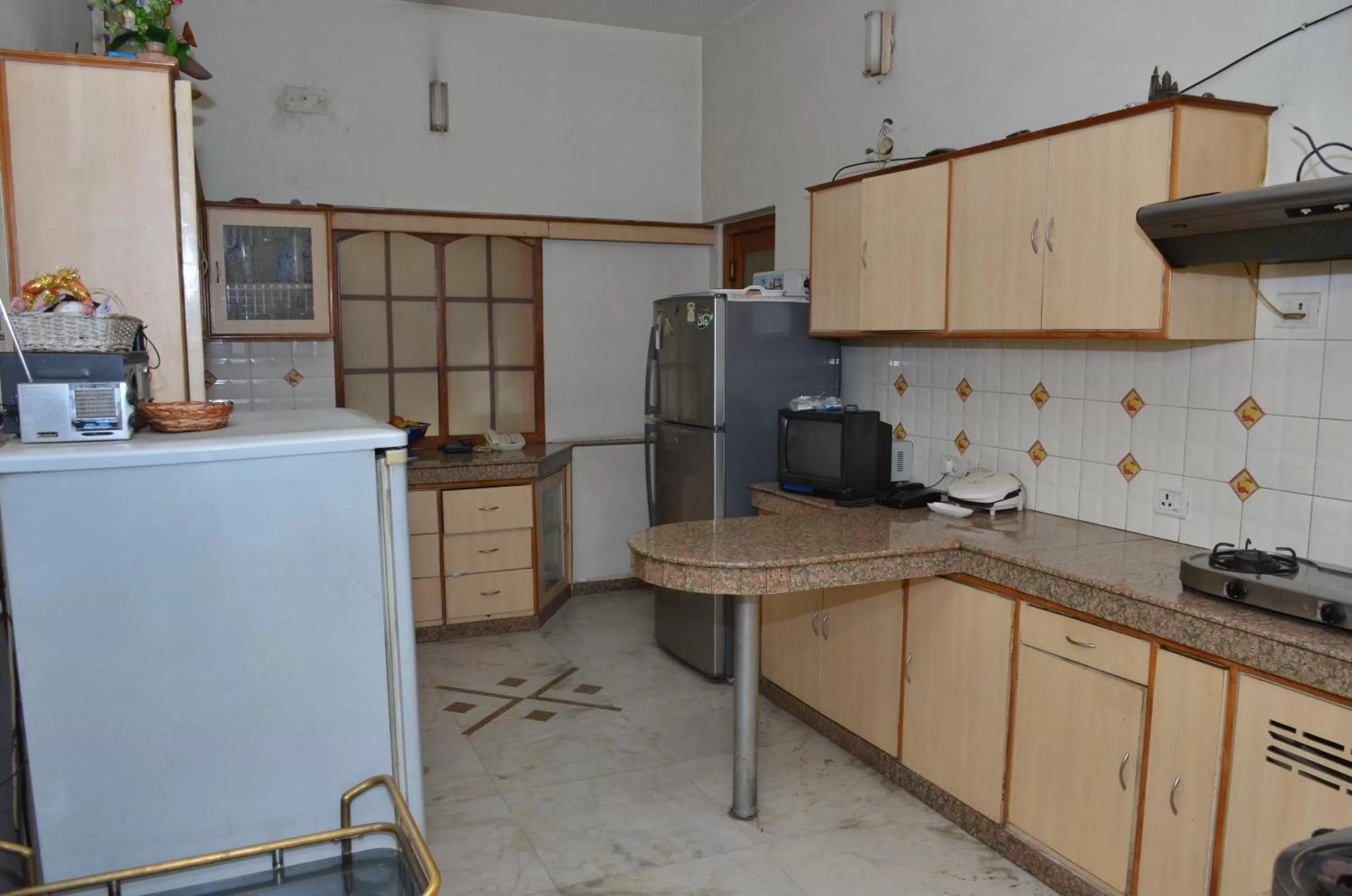 Kitchen or kitchenette in Sandy's Homestay