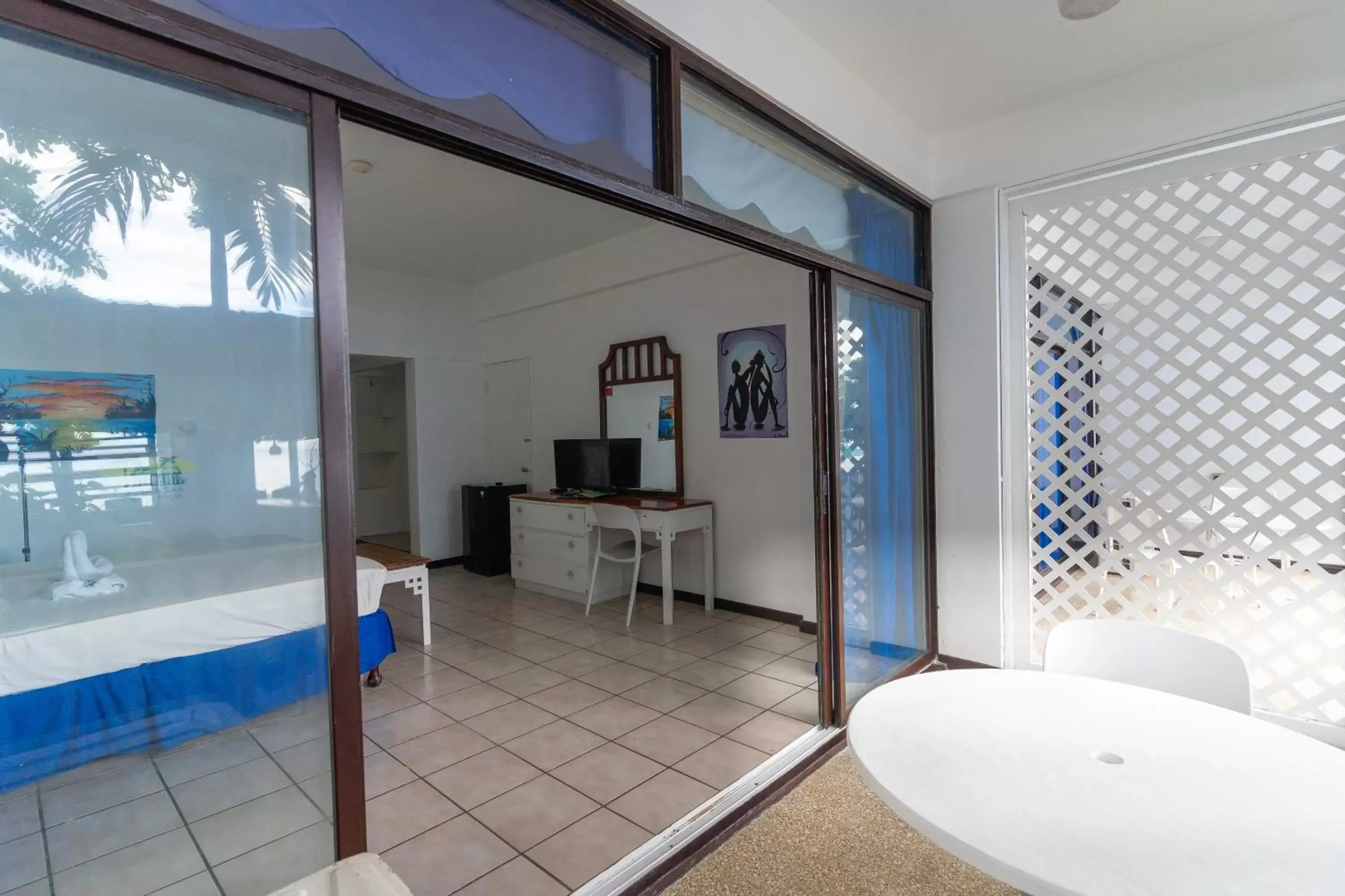 Bedroom in Sand and Tan Beach Hotel