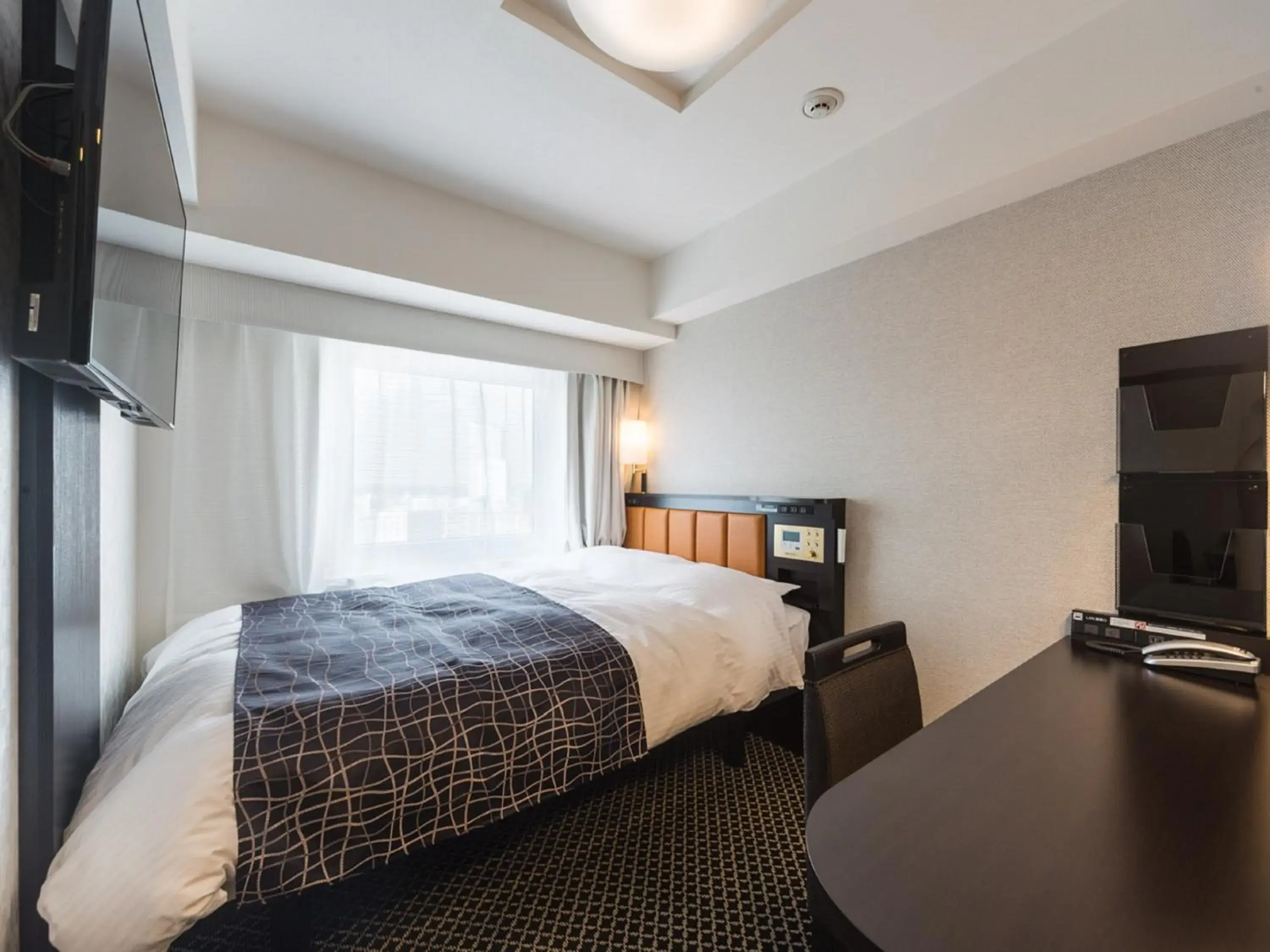 Bed in APA Hotel & Resort Nishishinjuku-Gochome-Eki Tower Bed in APA Hotel & Resort Nishishinjuku-Gochome-Eki Tower