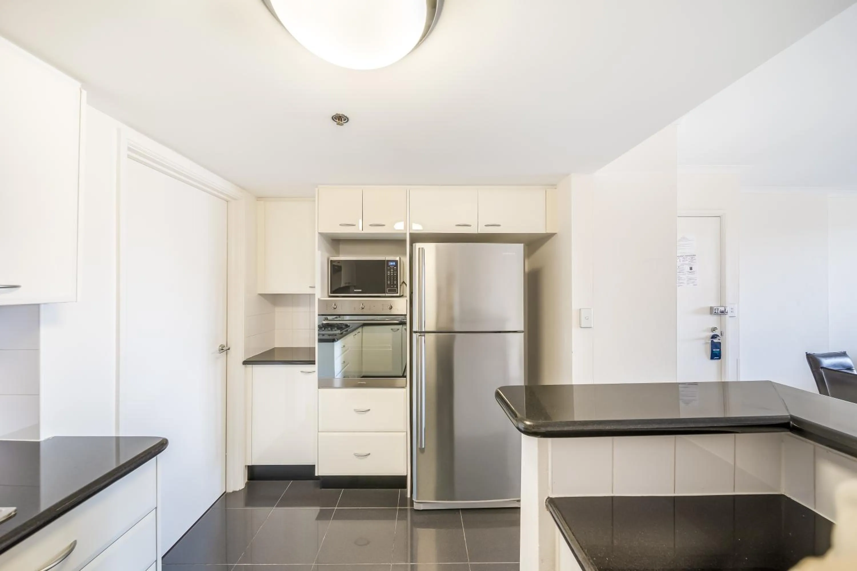 Kitchen or kitchenette in Oaks Sydney Castlereagh Suites