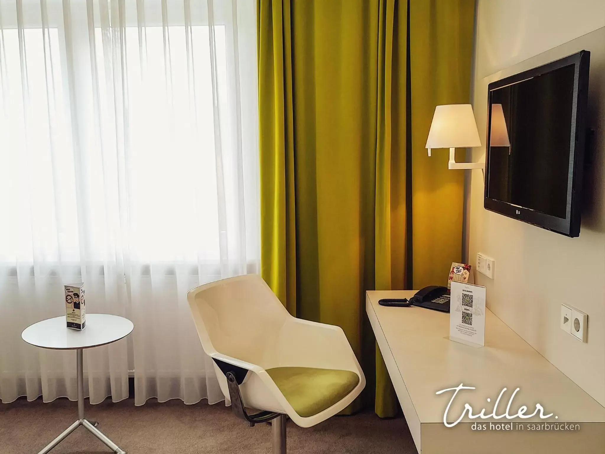 Seating area, TV/Entertainment Center in Hotel Am Triller - Hotel & Serviced Apartments
