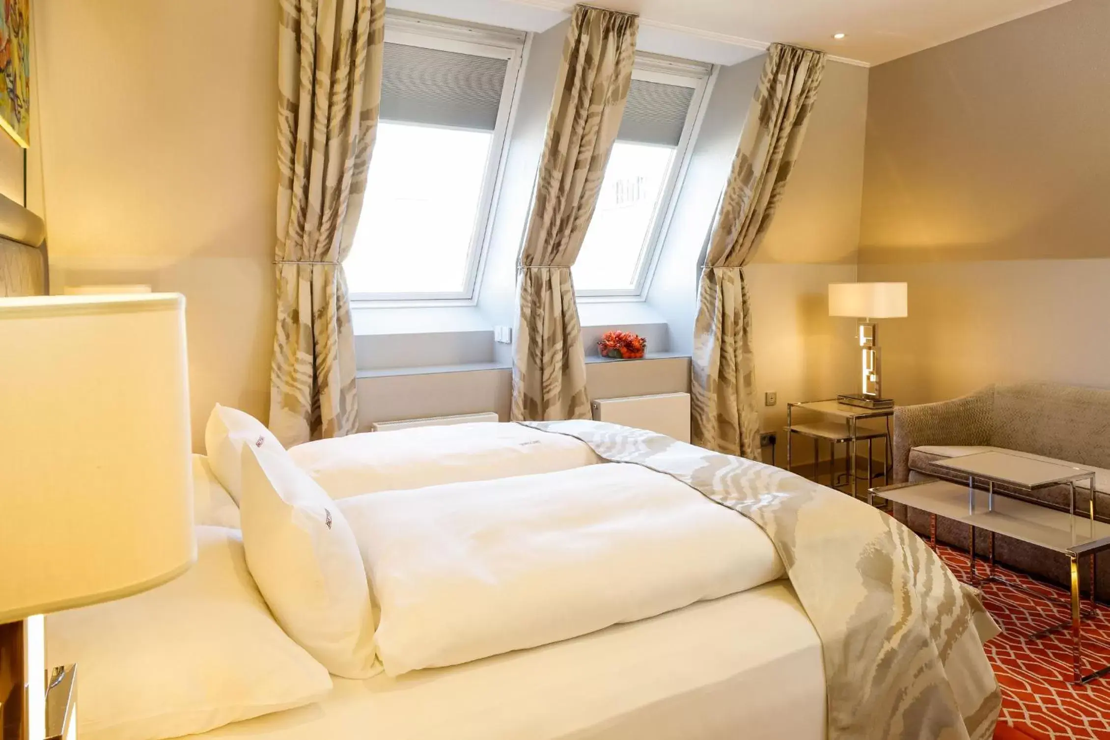 Bed in Boutiquehotel Das Tyrol