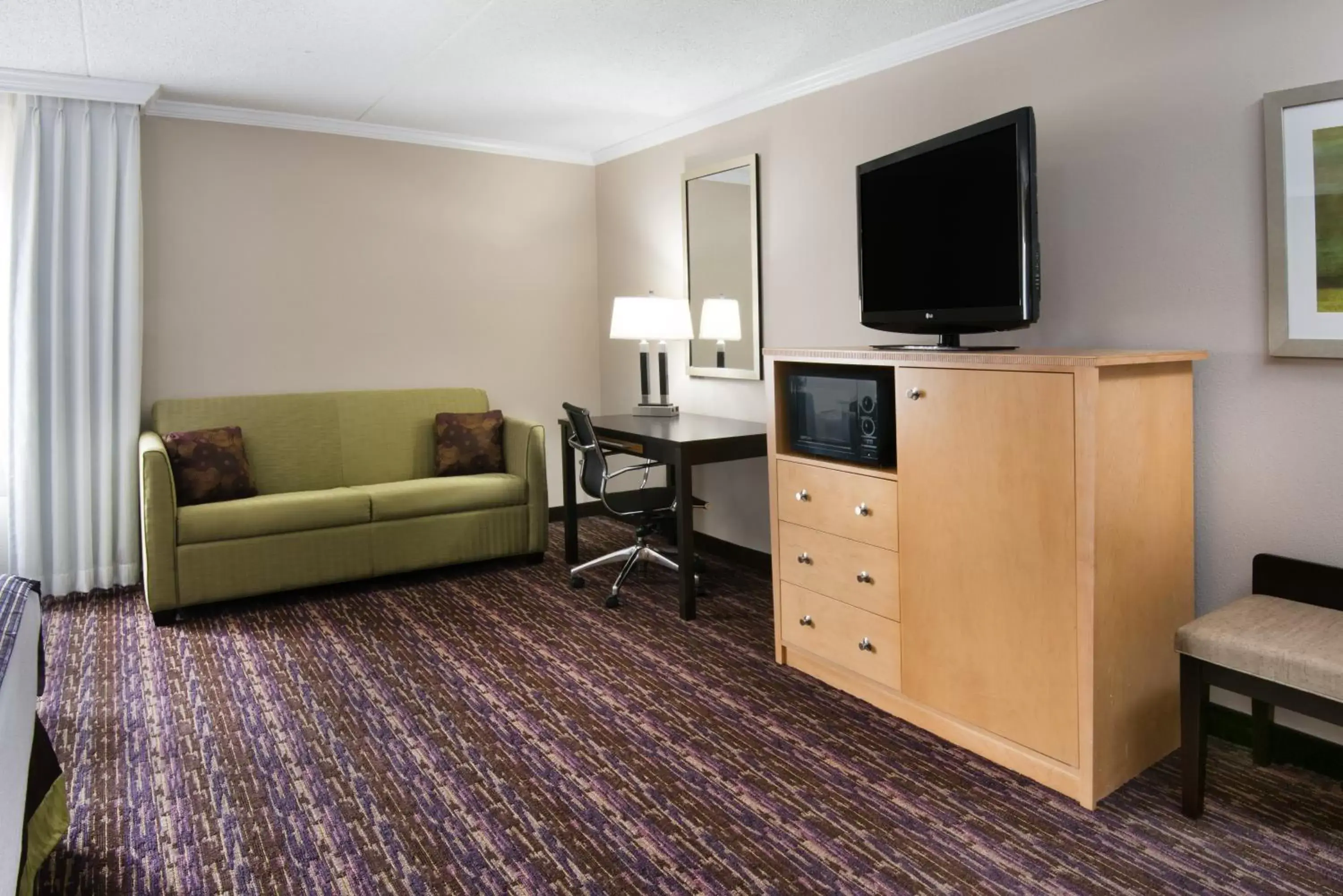 Photo of the whole room, TV/Entertainment Center in Holiday Inn Williamsport, an IHG Hotel
