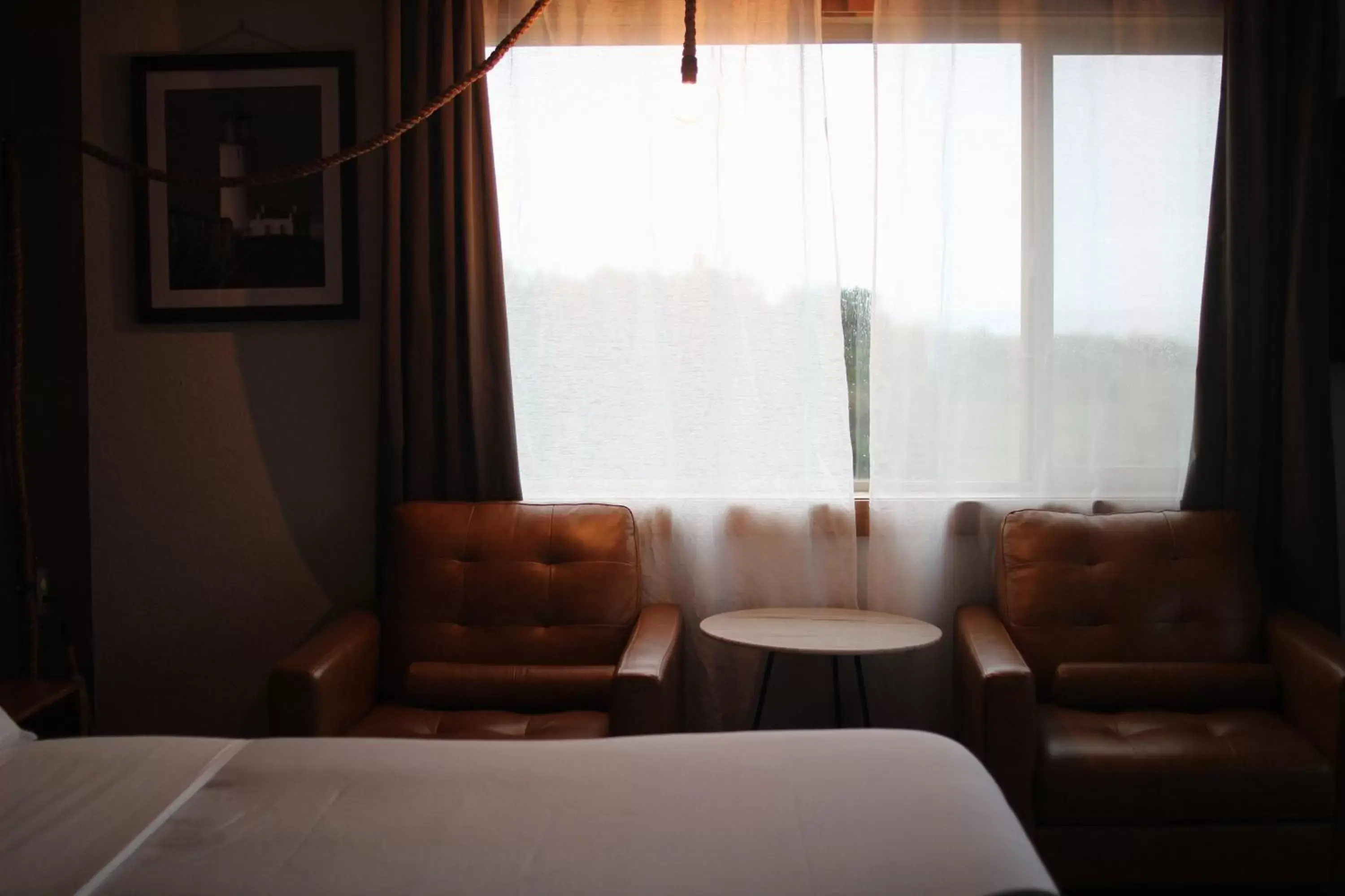 Bedroom, Seating Area in Adrift Hotel