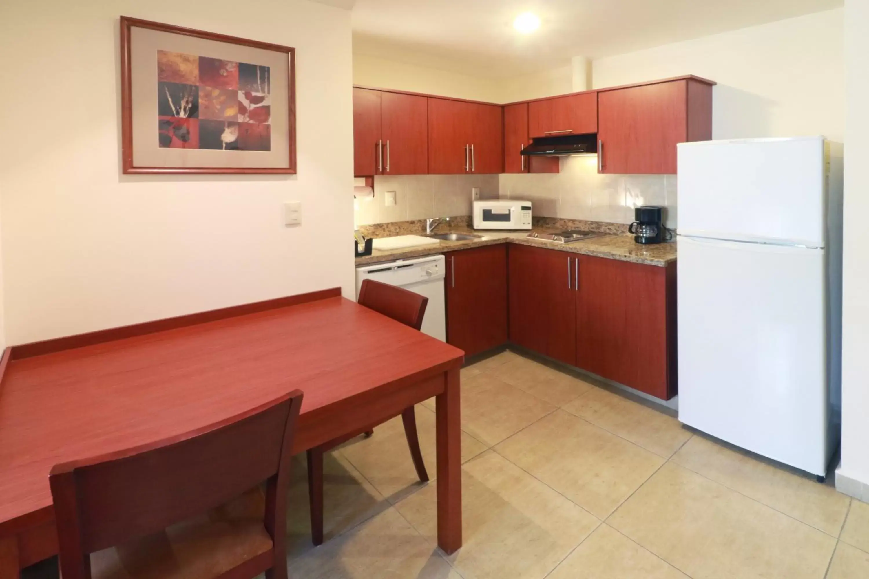 Bedroom, Kitchen/Kitchenette in Staybridge Suites Queretaro, an IHG Hotel