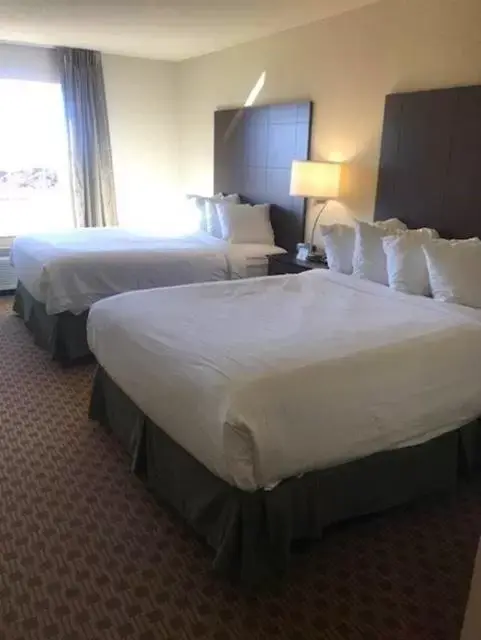 Bed in Cobblestone Inn & Suites - Harper