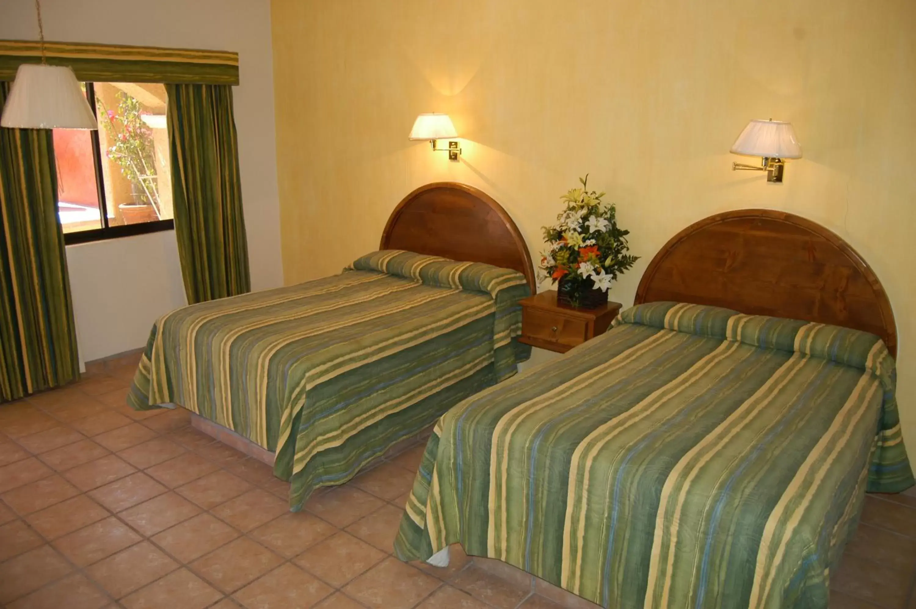 Photo of the whole room, Bed in Hacienda Suites Loreto