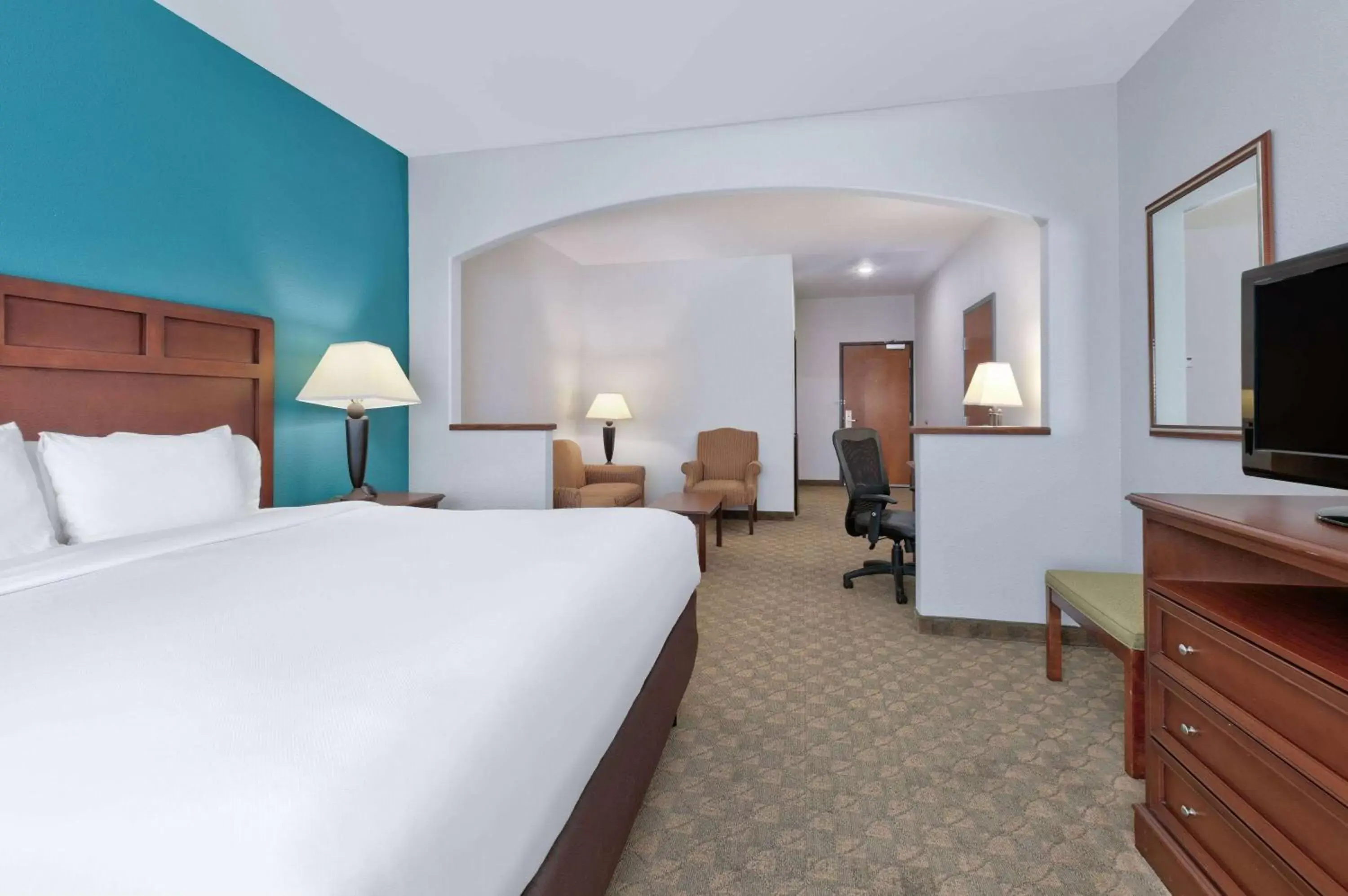 Bed in Baymont Inn & Suites by Wyndham Glen Rose