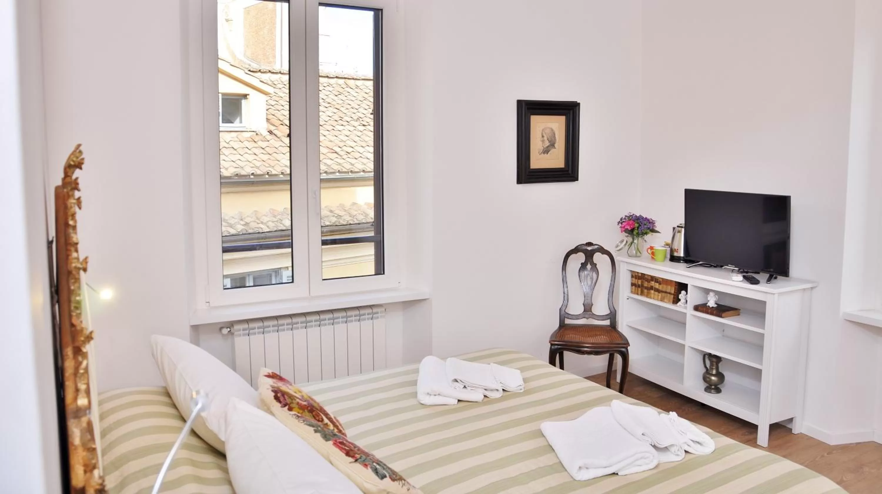 Photo of the whole room, TV/Entertainment Center in B&B Casa Angelini